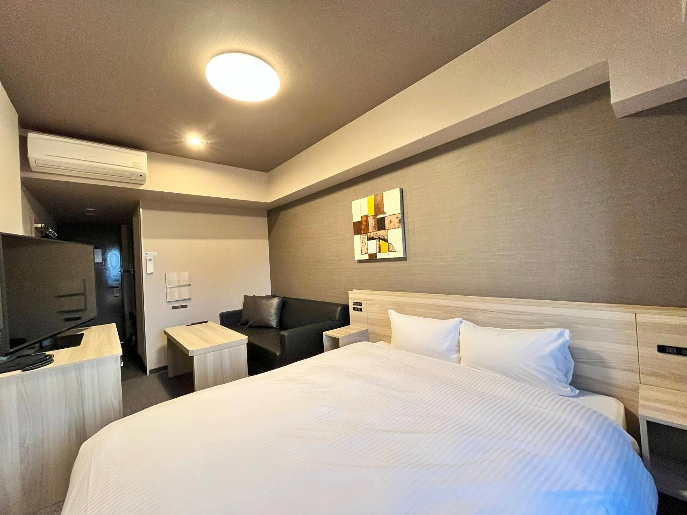 Photo of the whole room, Bed in Hotel Route-Inn Nagaoka Ekimae