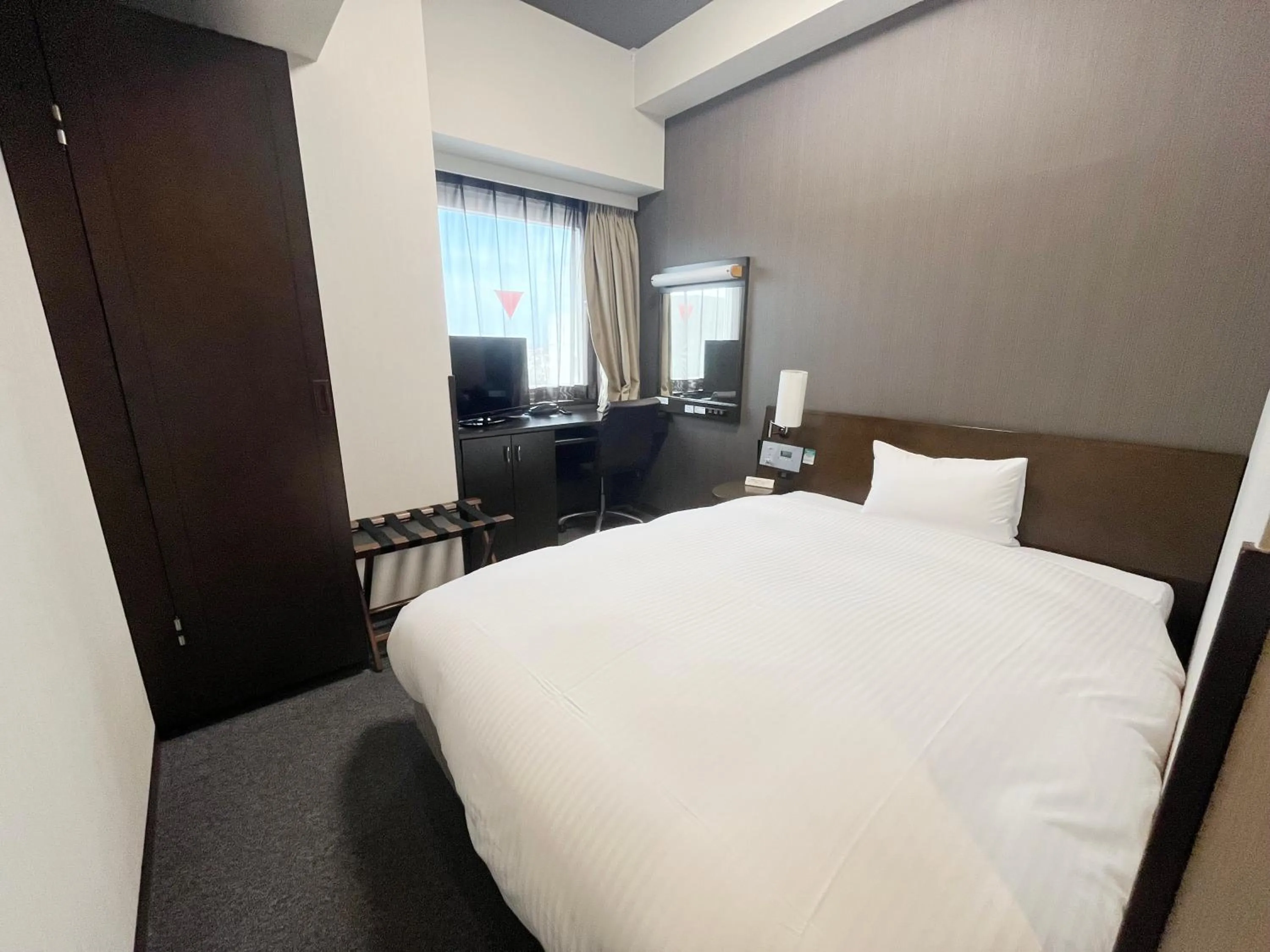 Photo of the whole room, Bed in Hotel Route-Inn Fukui Ekimae