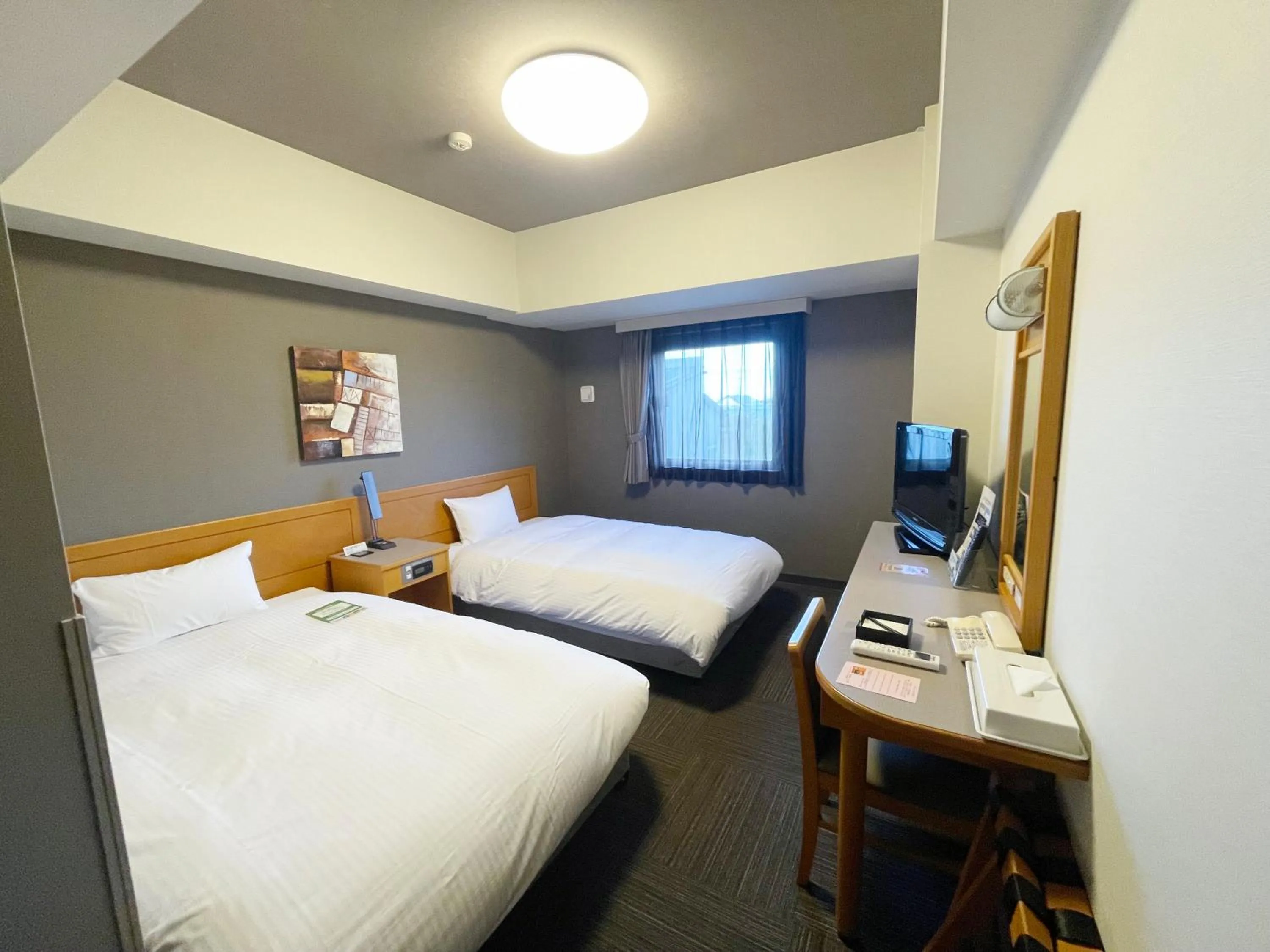 Photo of the whole room, Bed in Hotel Route-Inn Tsubamesanjo Ekimae