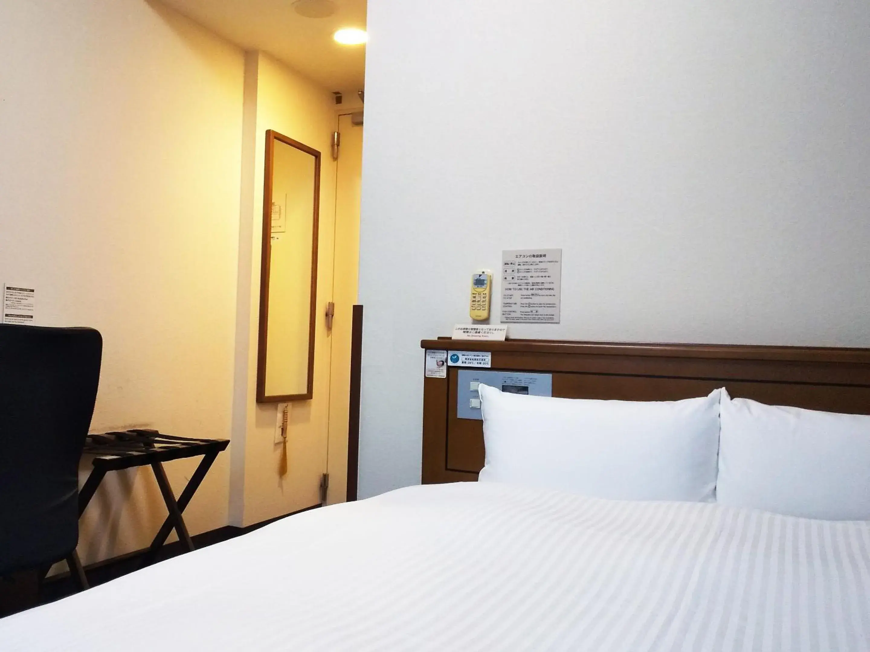 Photo of the whole room, Bed in Hotel Route-Inn Tsuruga Ekimae Photo of the whole room, Bed in Hotel Route-Inn Tsuruga Ekimae