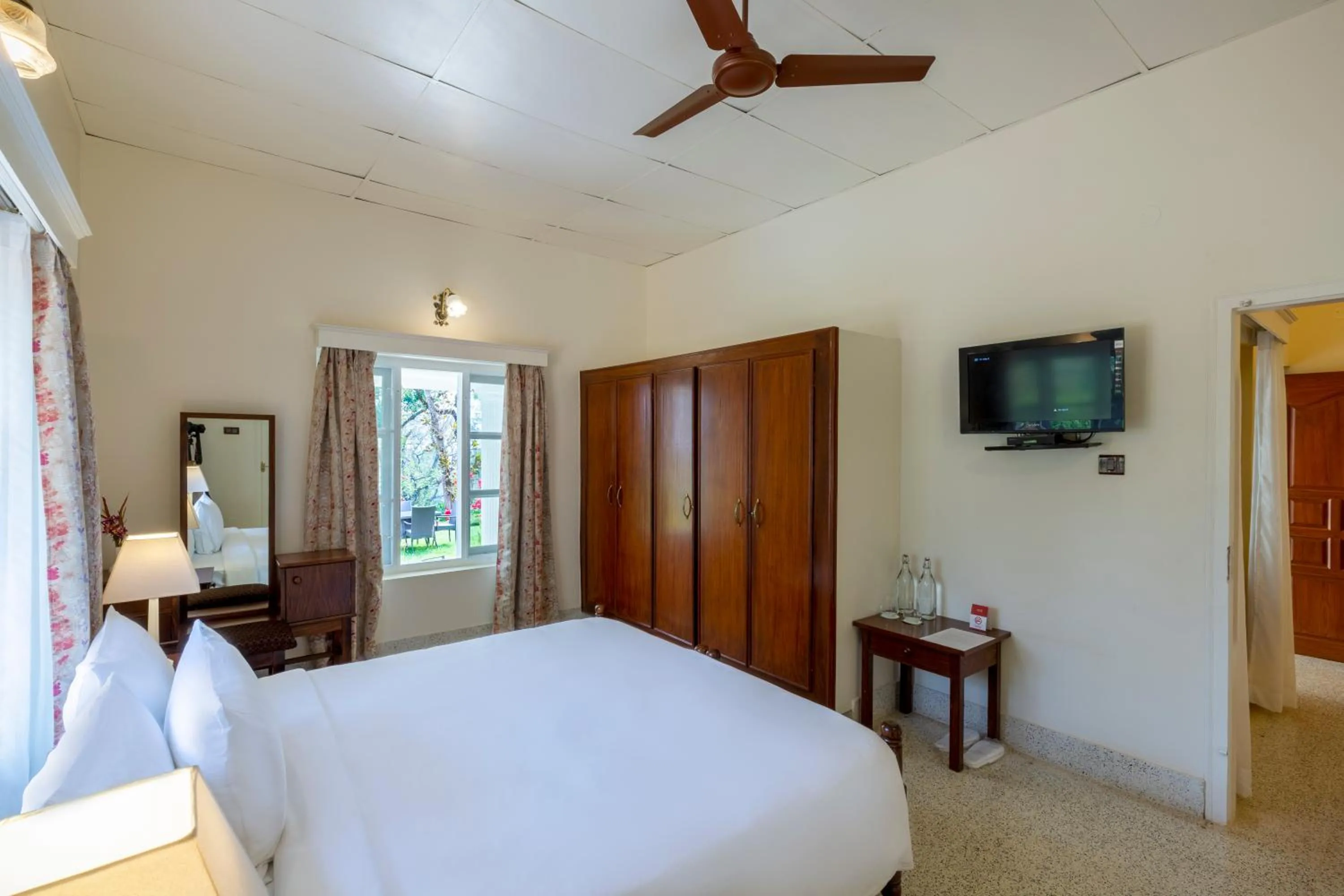 Communal lounge/ TV room, Bed in Ama Plantation Trails Coorg