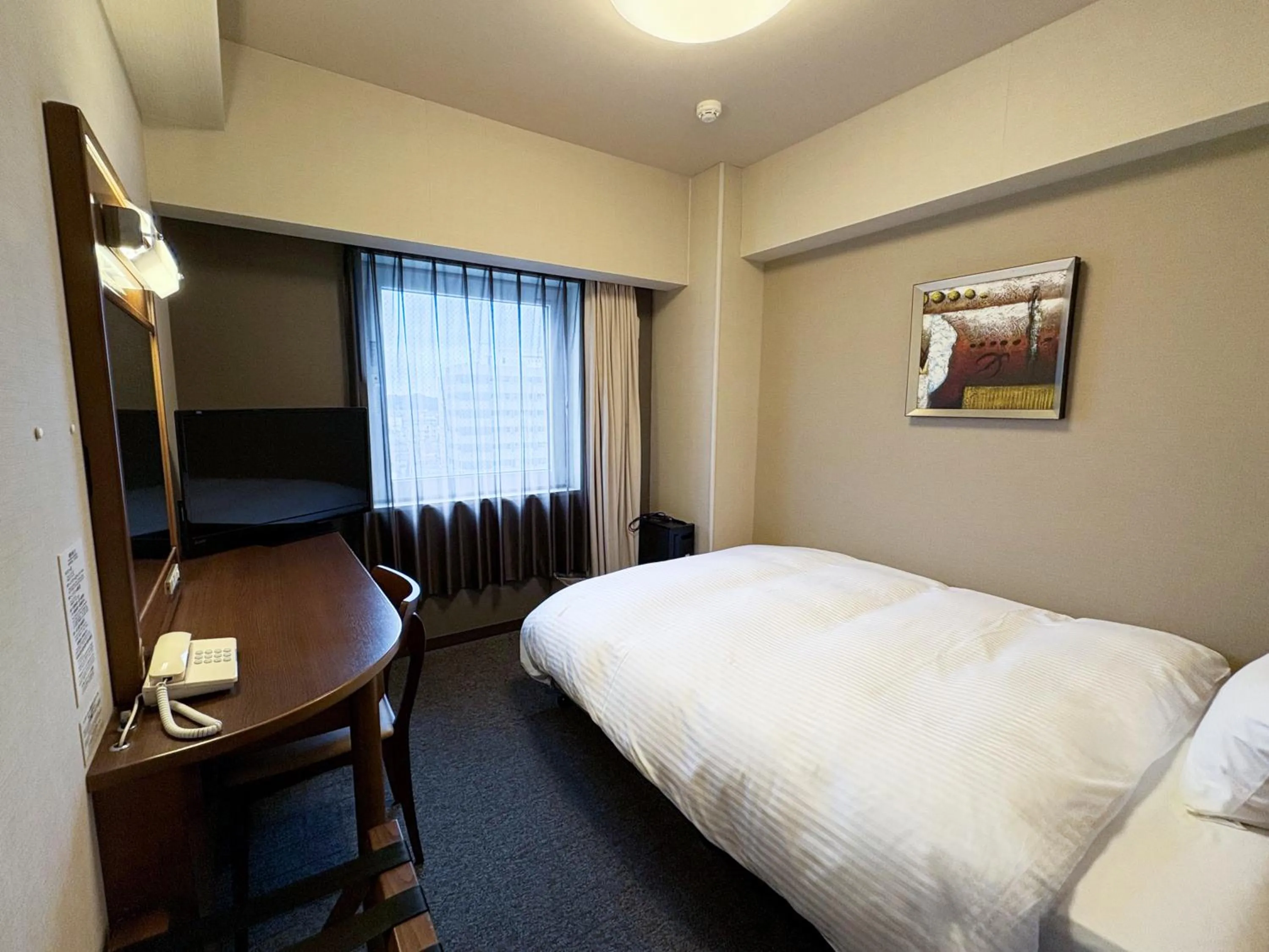 Photo of the whole room, Bed in Hotel Route-Inn Iwaki Ekimae
