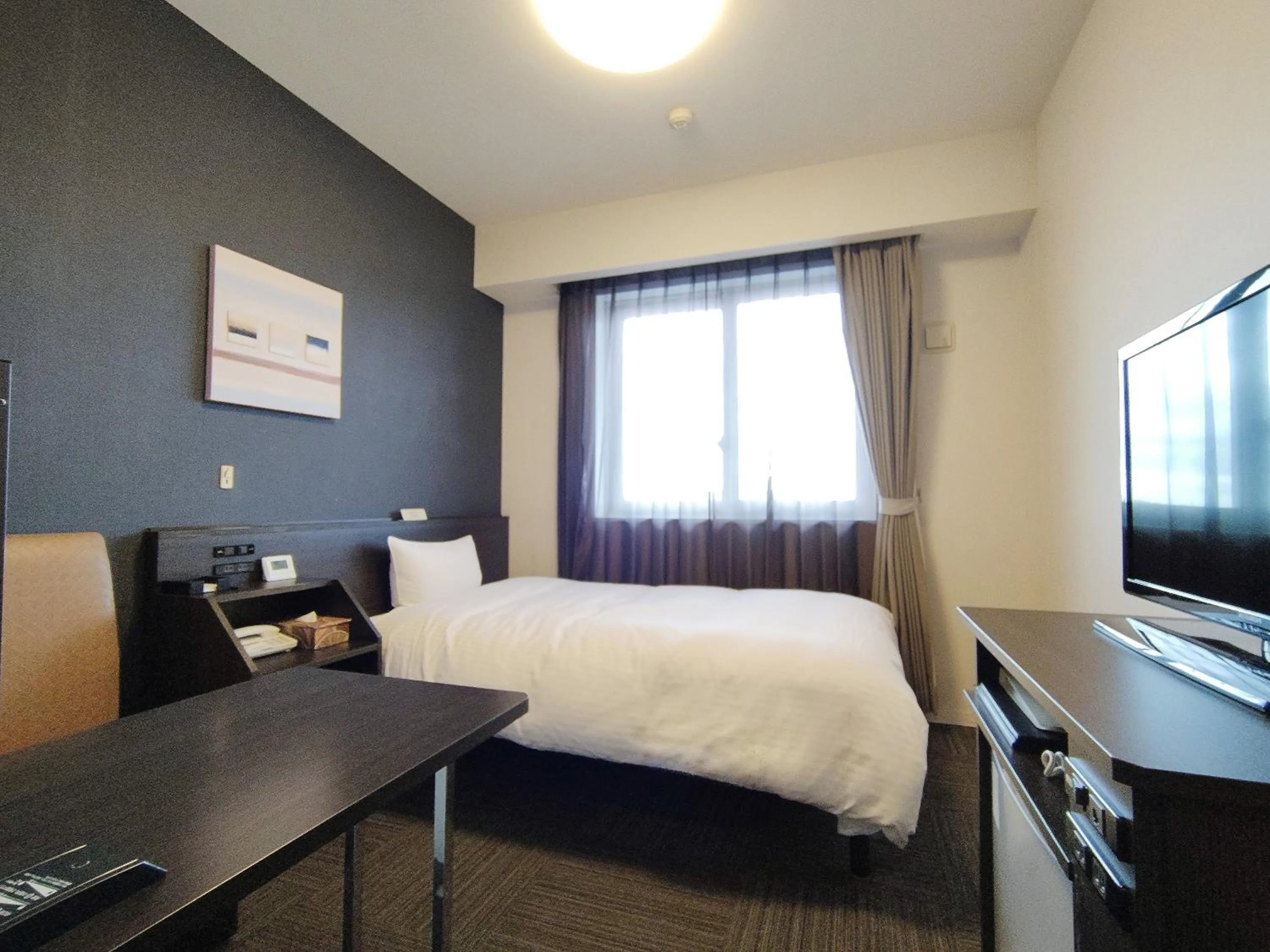 Photo of the whole room, Bed in Hotel Route-Inn Iwakiizumi Ekimae
