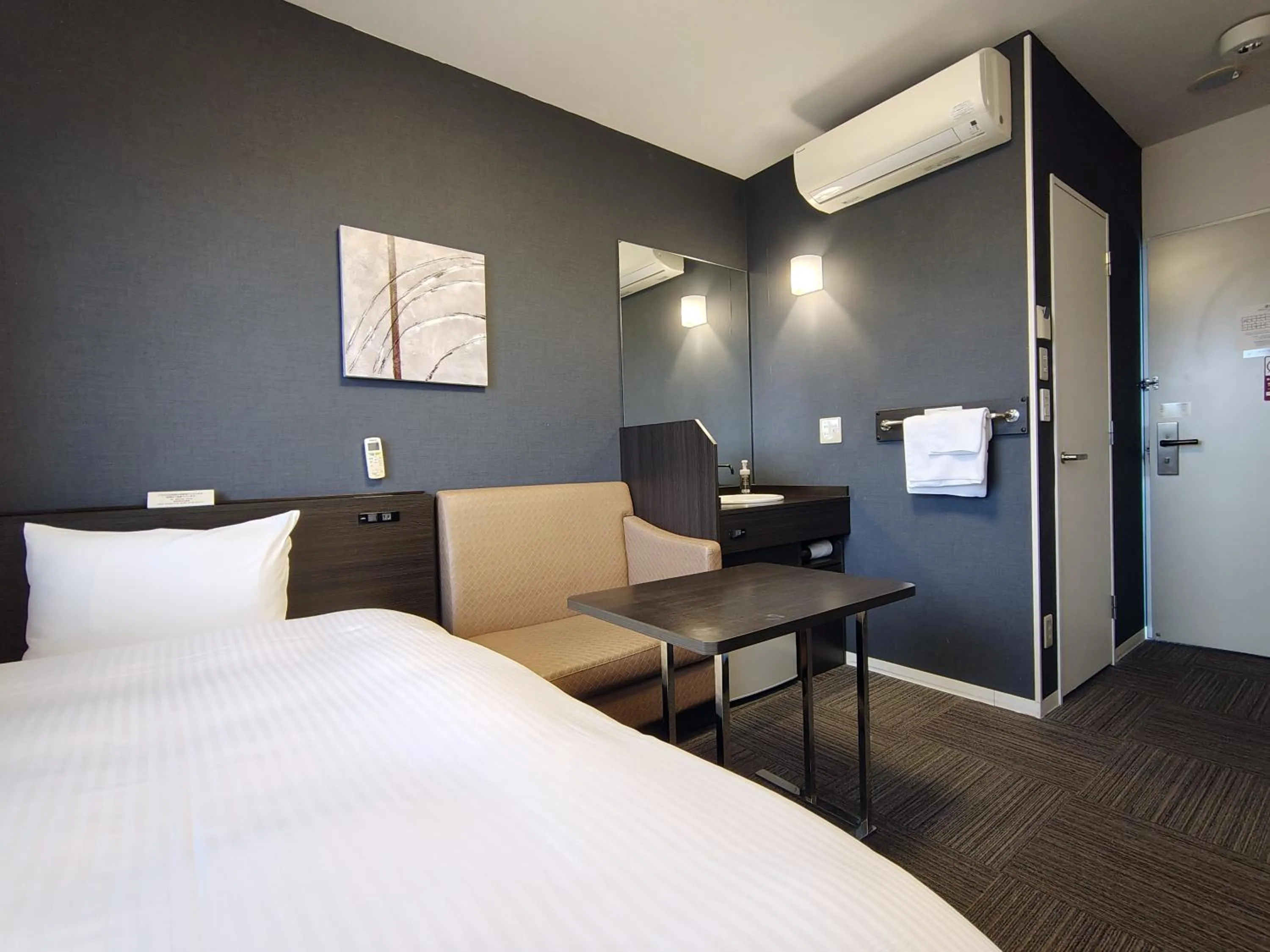 Photo of the whole room, Bed in Hotel Route-Inn Iwakiizumi Ekimae