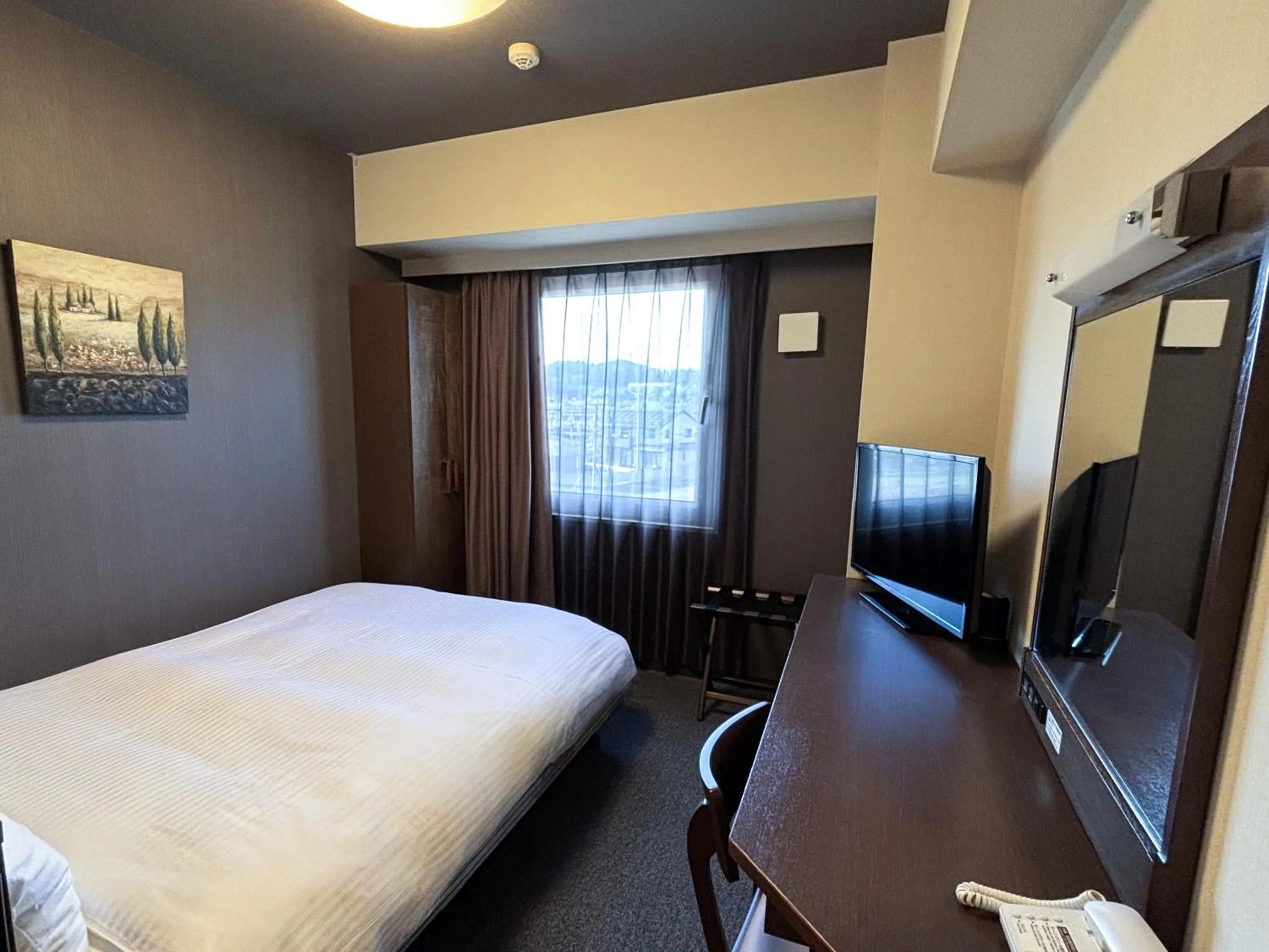 Photo of the whole room, Bed in Hotel Route-Inn Iwakiizumi Ekimae
