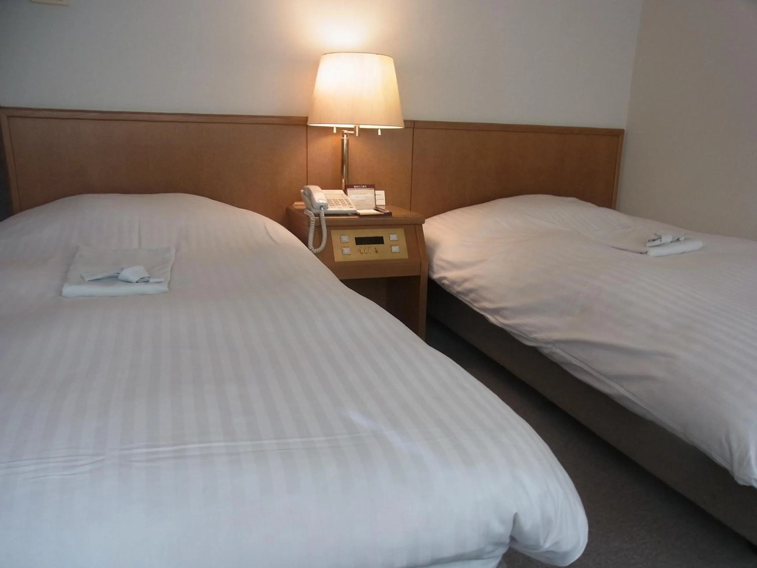 Bed in Hotel New Mogamiya