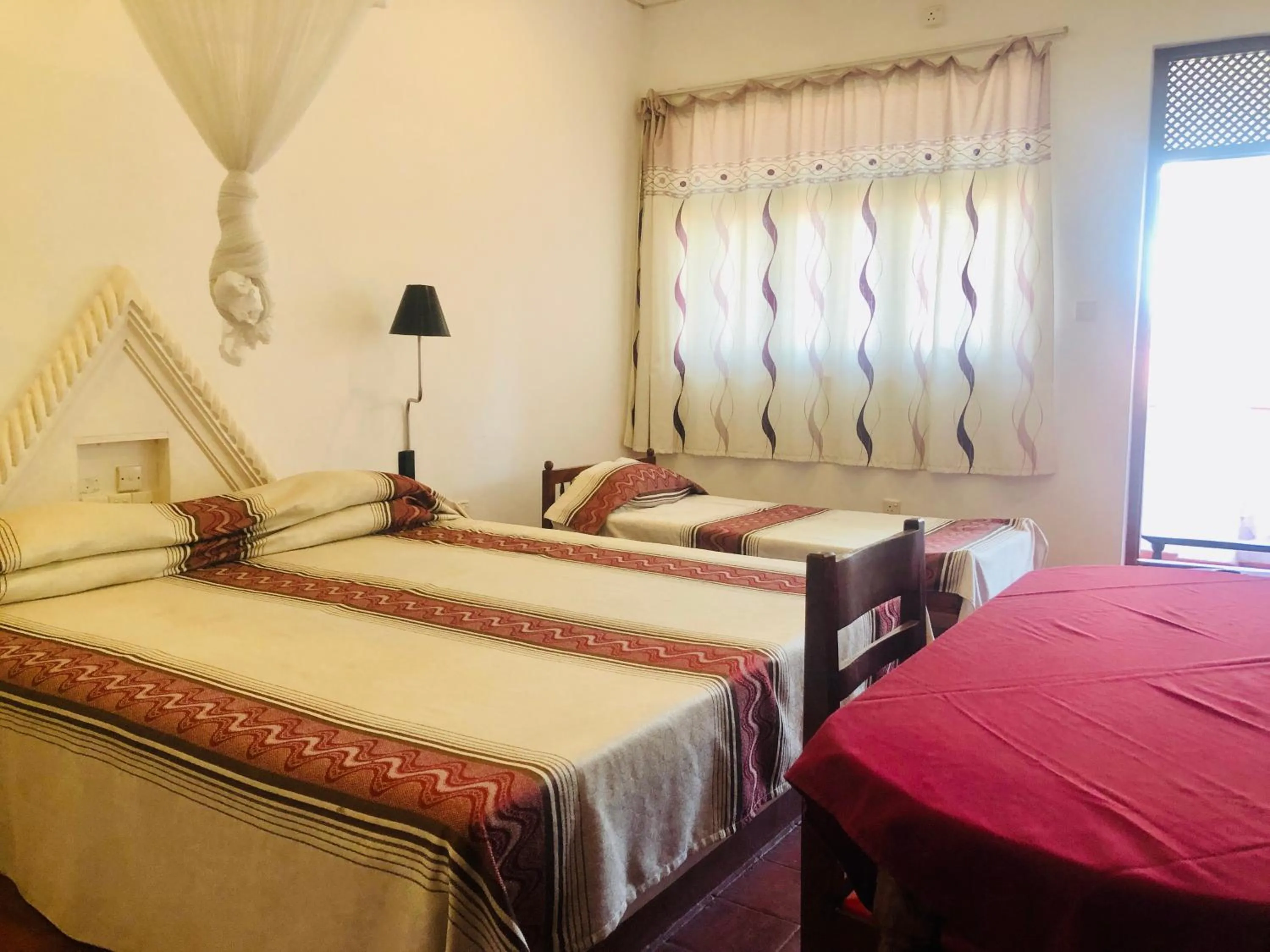 Bed in Hotel Hemadan