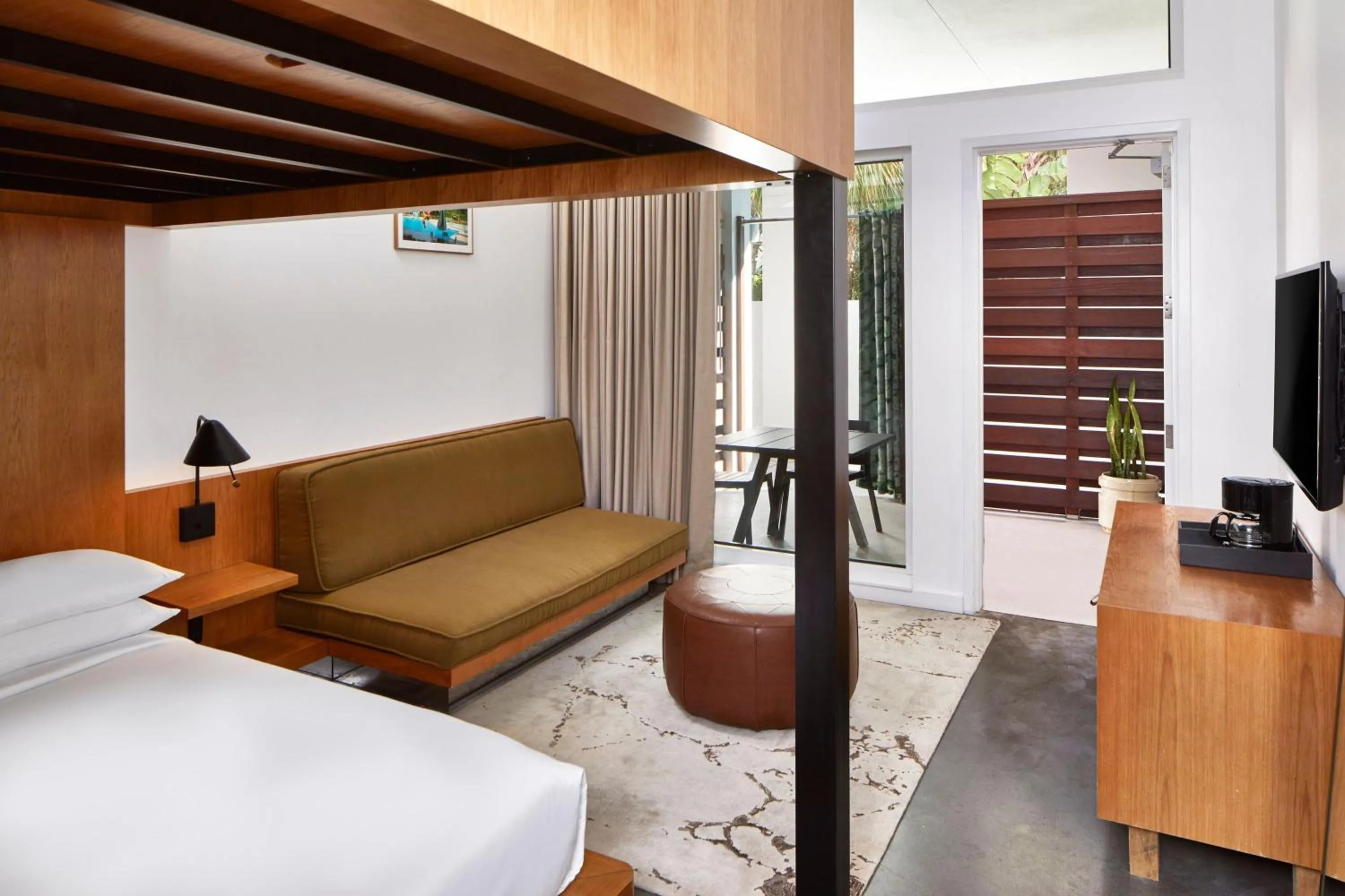 Living room, Bed in The Sarasota Modern, a Tribute Portfolio Hotel