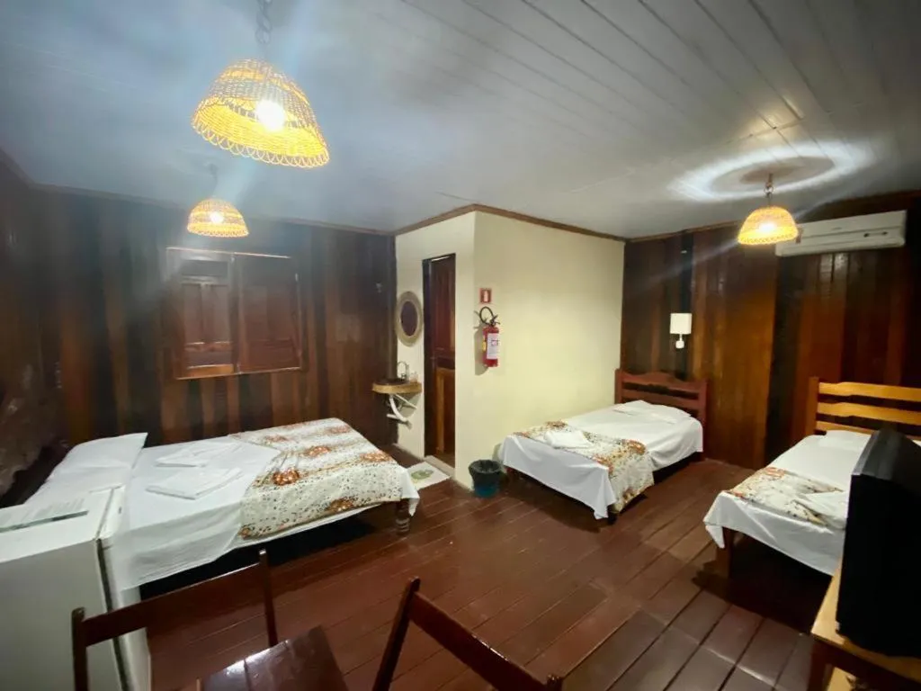 Bed in Pousada Encantos da Amazônia