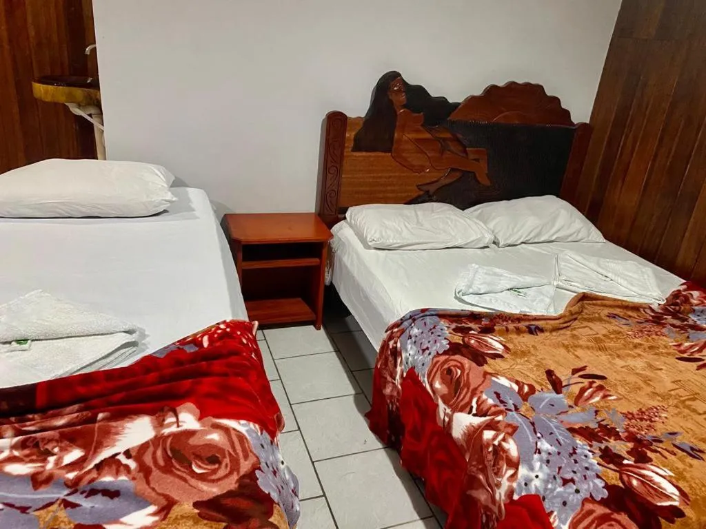 Bed in Pousada Encantos da Amazônia