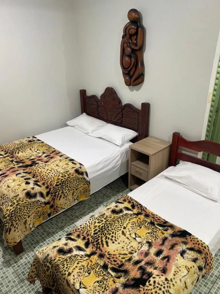 Bed in Pousada Encantos da Amazônia