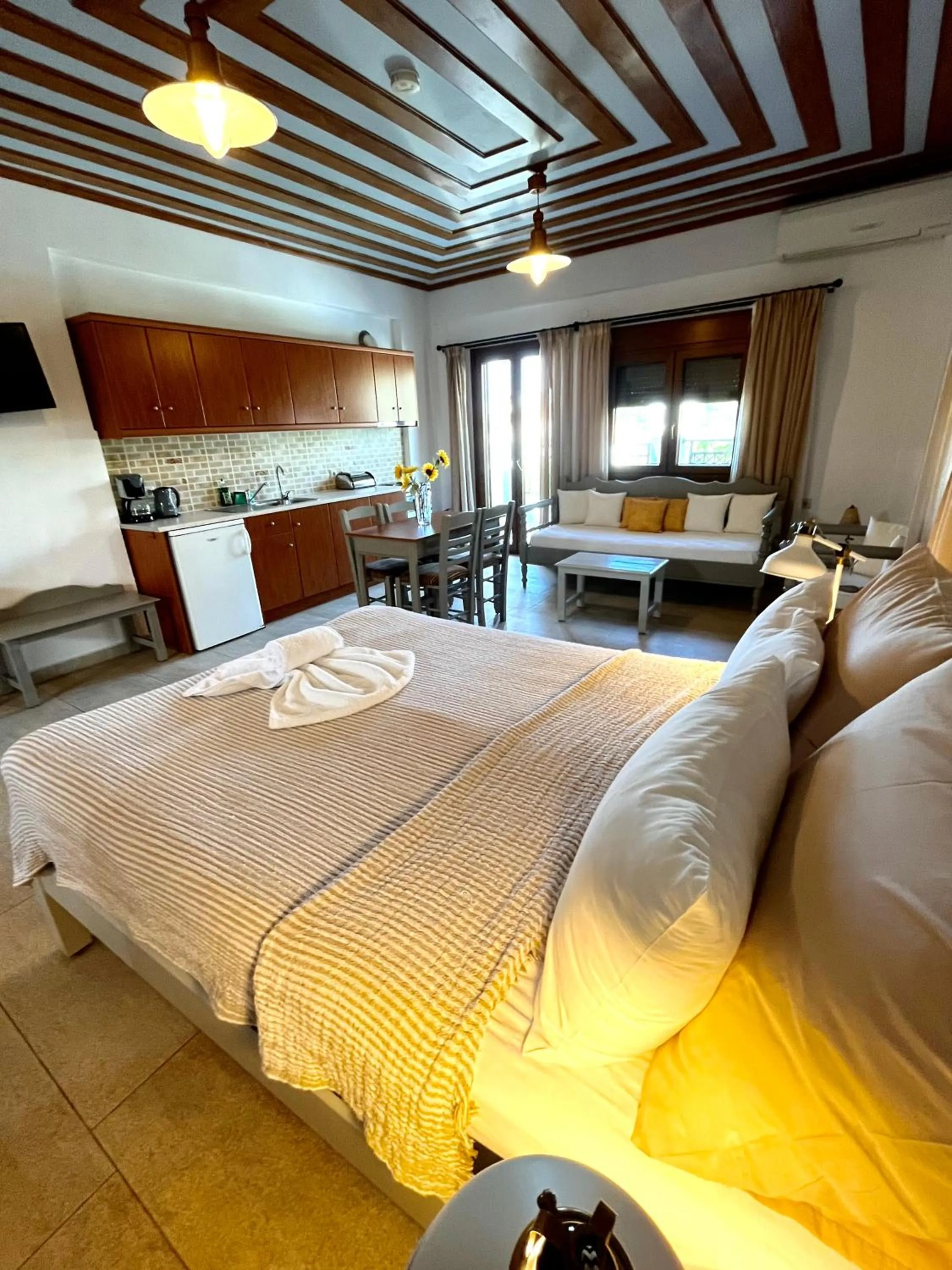 Bed in Pantheon Apartments & Studios