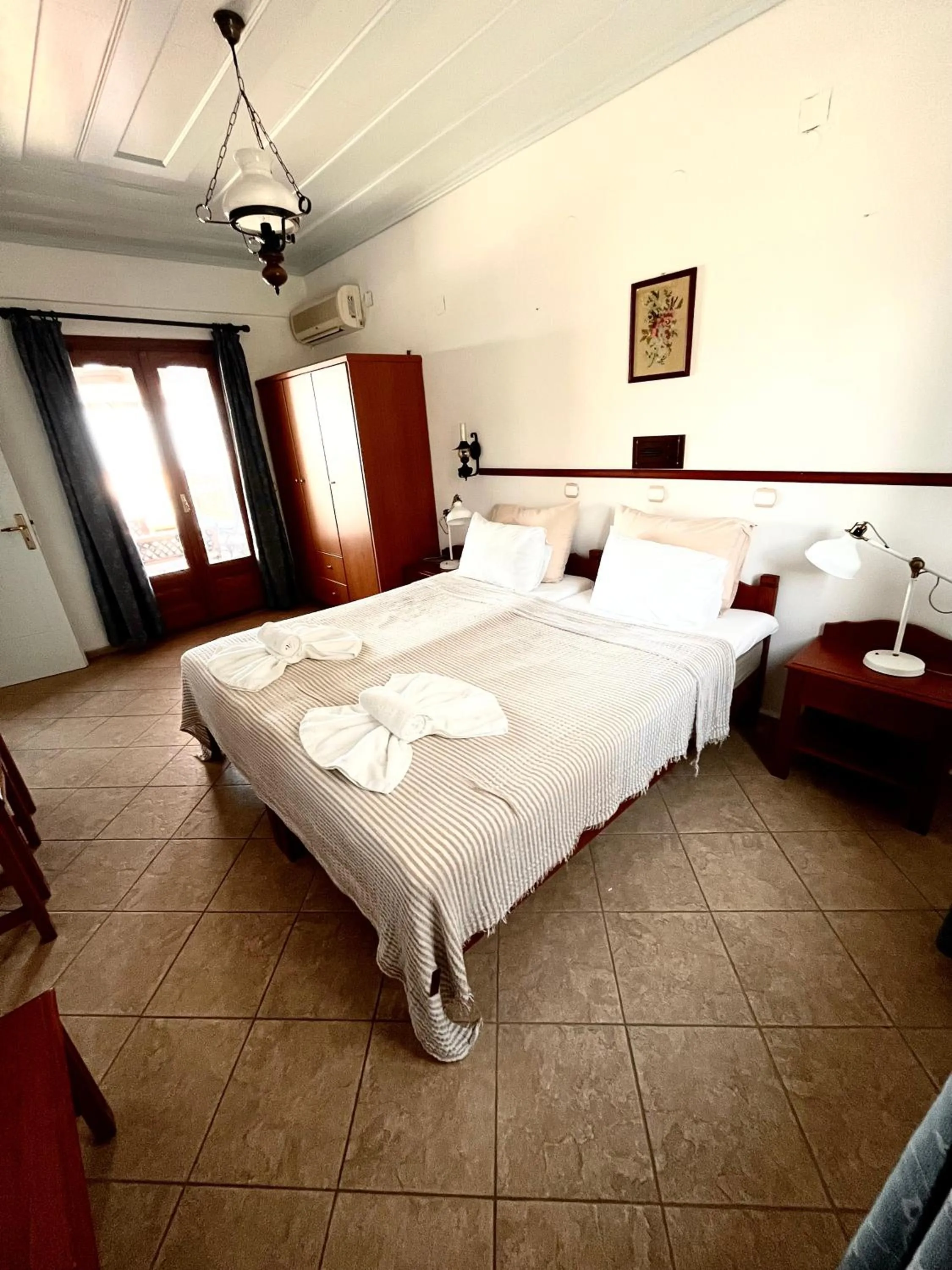 Bed in Pantheon Apartments & Studios