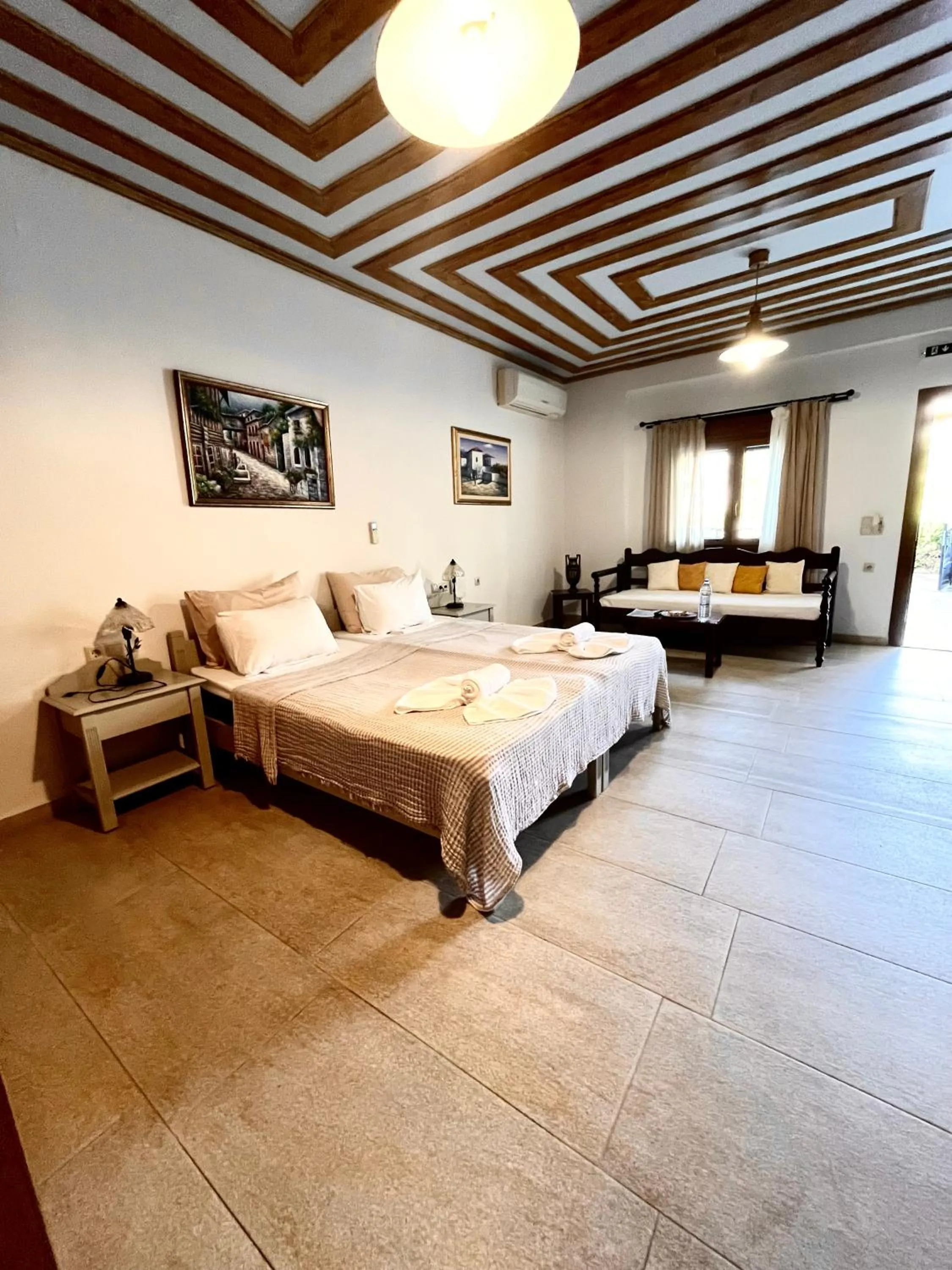 Bed in Pantheon Apartments & Studios