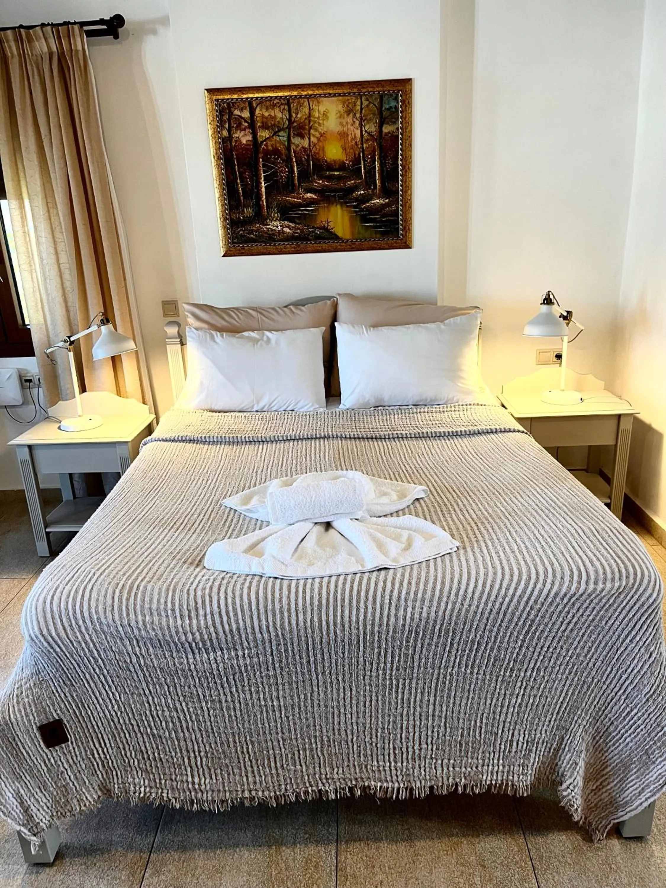 Bed in Pantheon Apartments & Studios