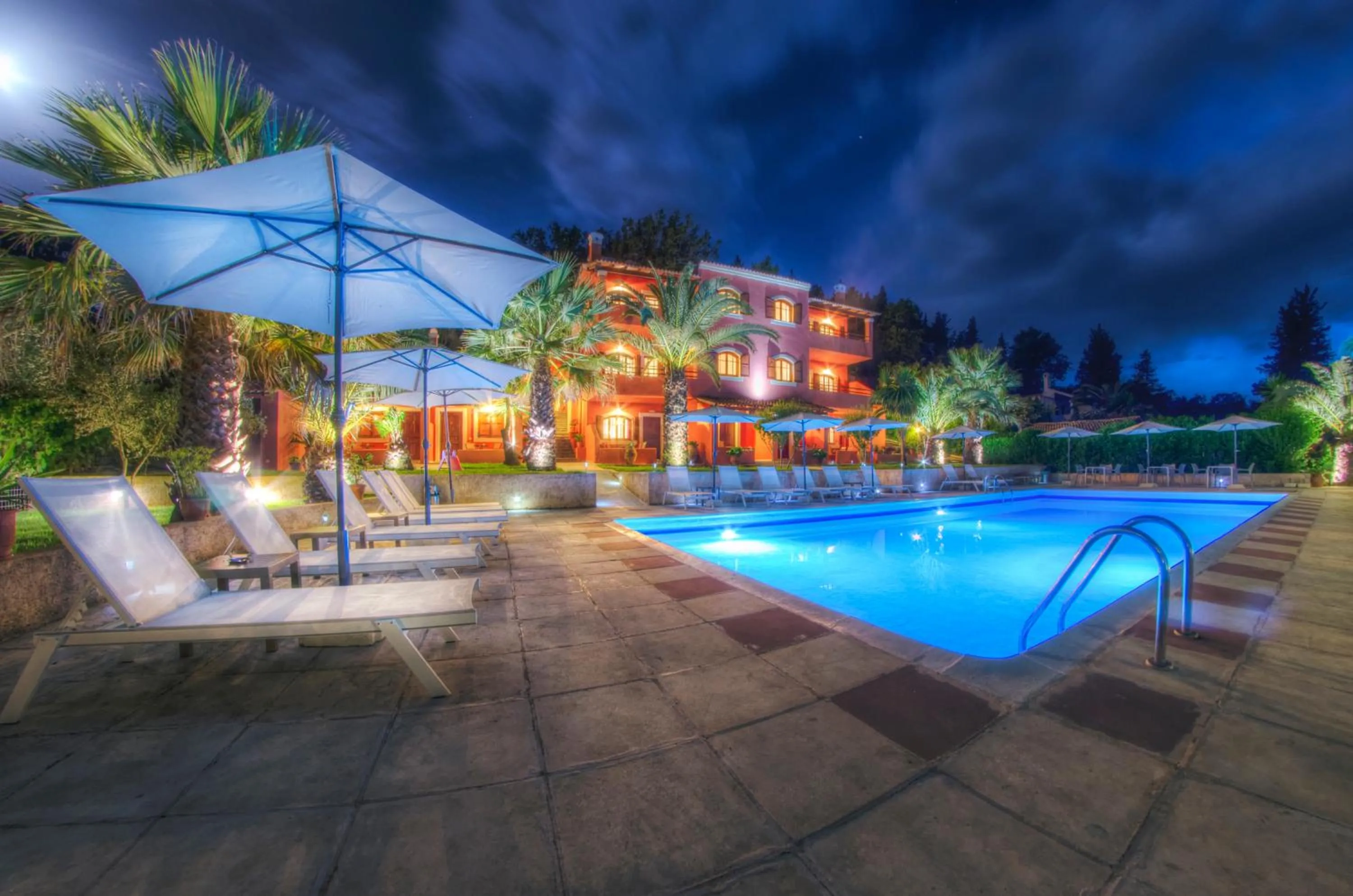 Property building in The Palm Garden - Idyllic Pool Apartments in a Green Oasis