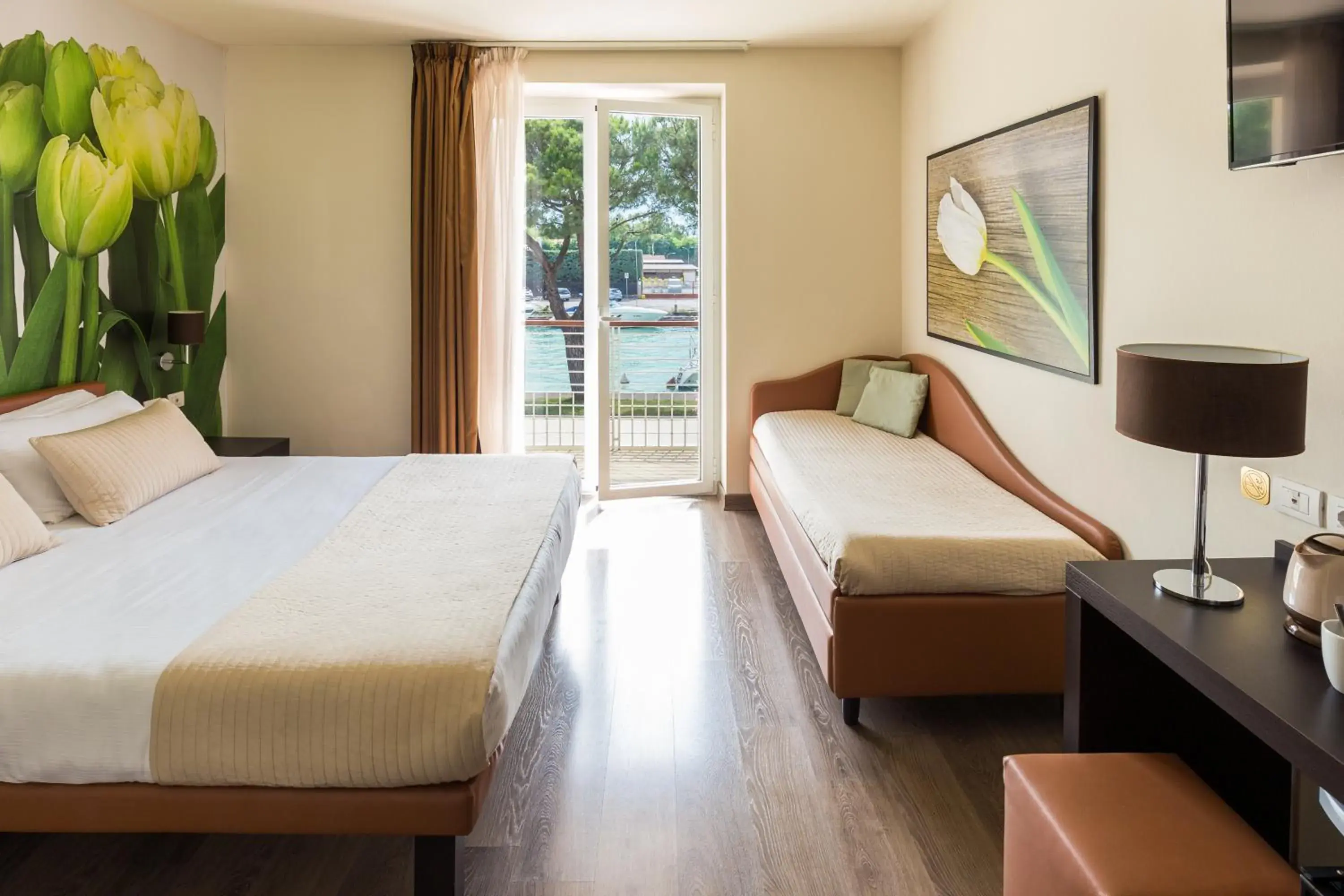 Triple Room with Balcony and Lake View in Hotel Acquadolce Triple Room with Balcony and Lake View in Hotel Acquadolce