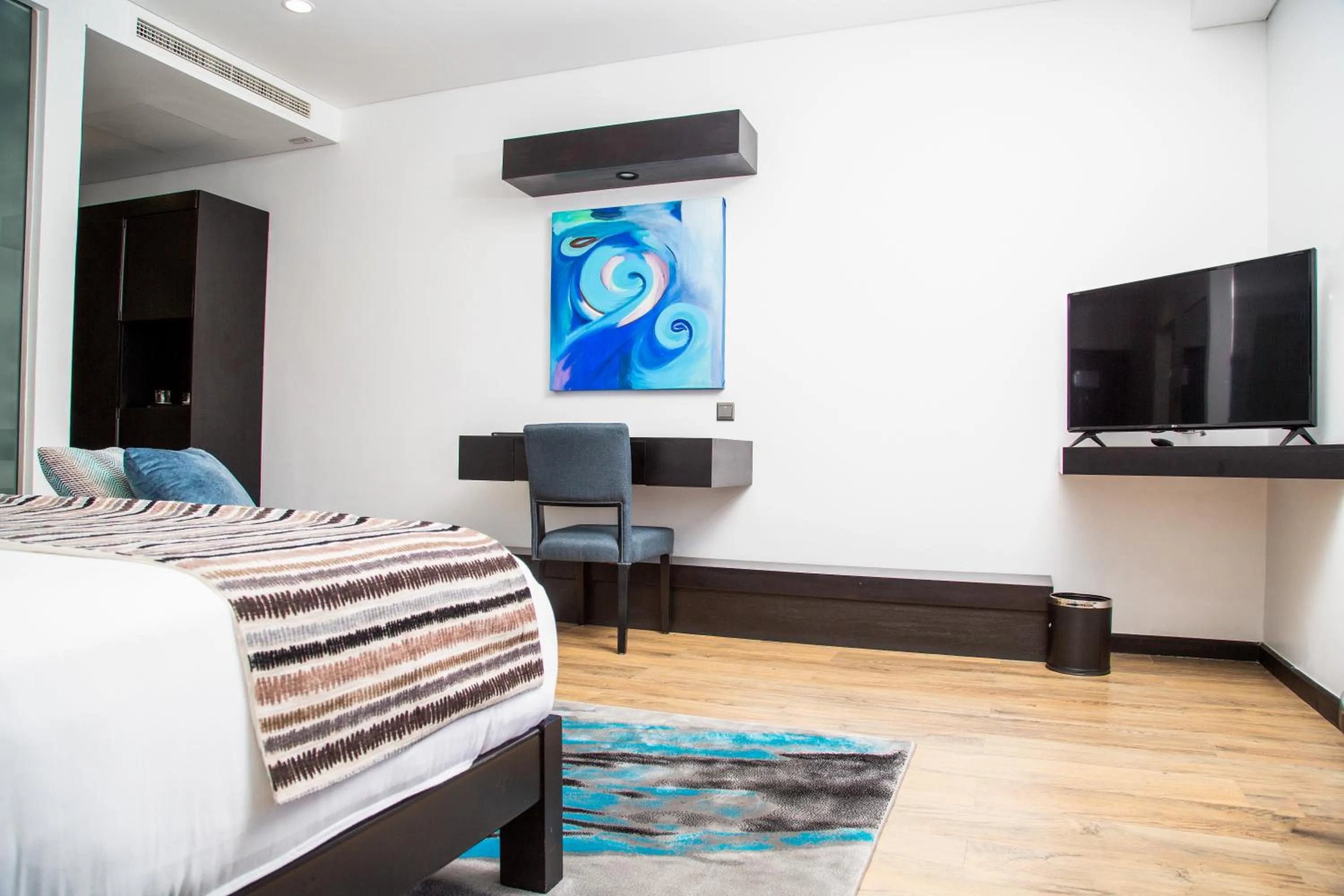 Communal lounge/ TV room, Bed in Amaryllis Hotel Blantyre