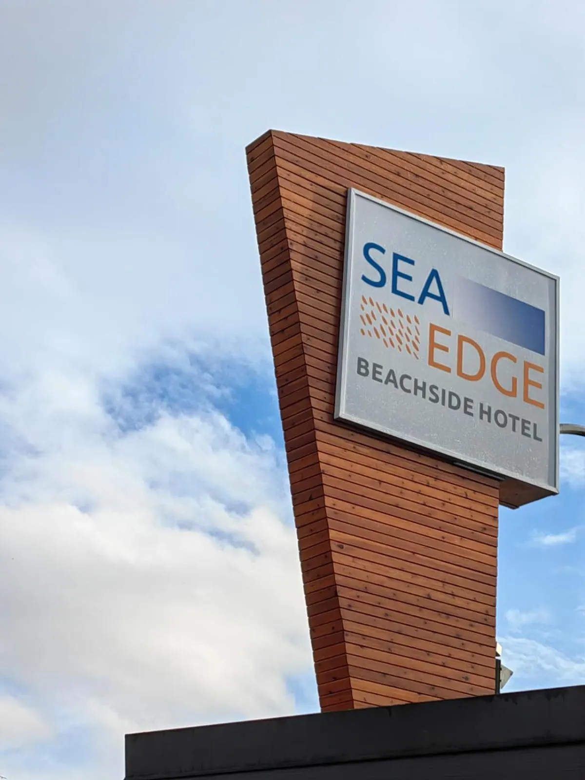 Property logo or sign in Sea Edge Beachside Hotel