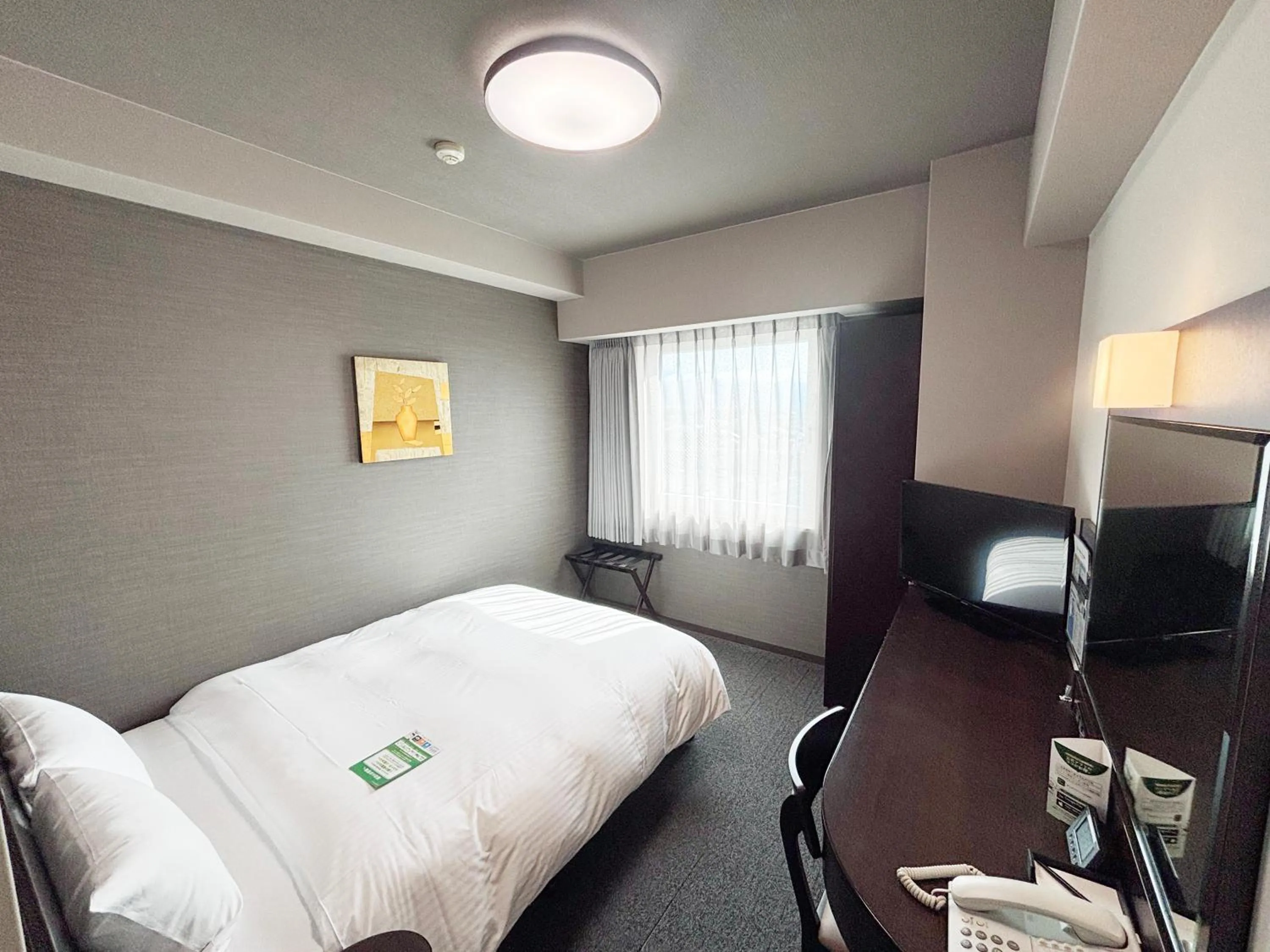 Photo of the whole room, Bed in Hotel Route-Inn Iyo-Saijo