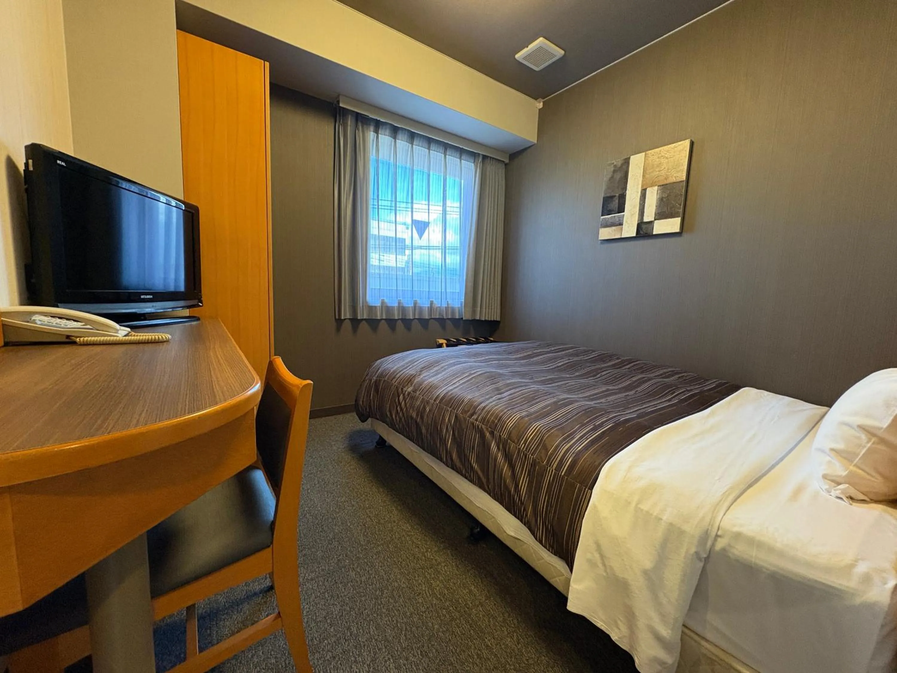 Photo of the whole room, Bed in Hotel Route-Inn Niihama