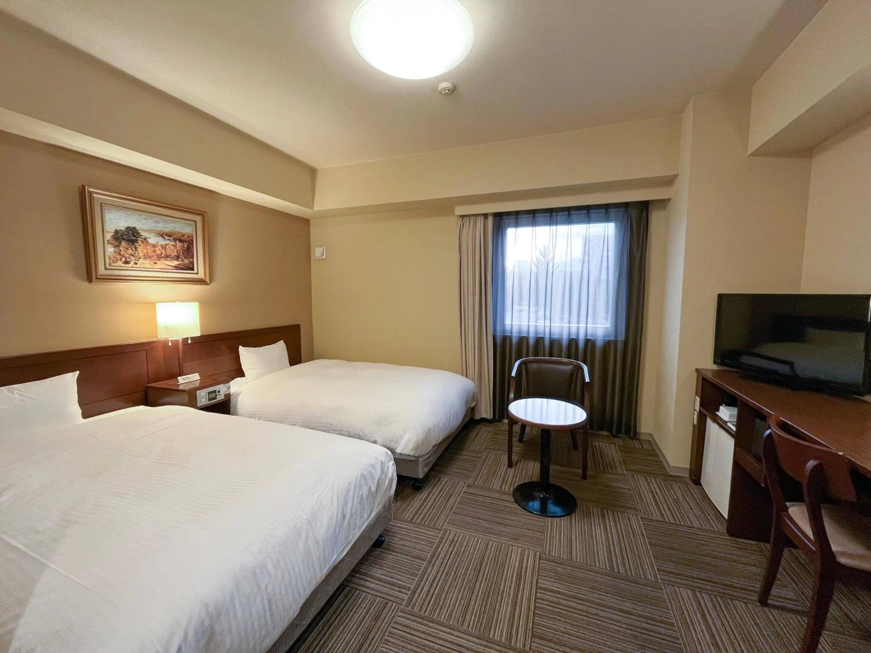 Photo of the whole room, Bed in Hotel Route-Inn Hofu Ekimae