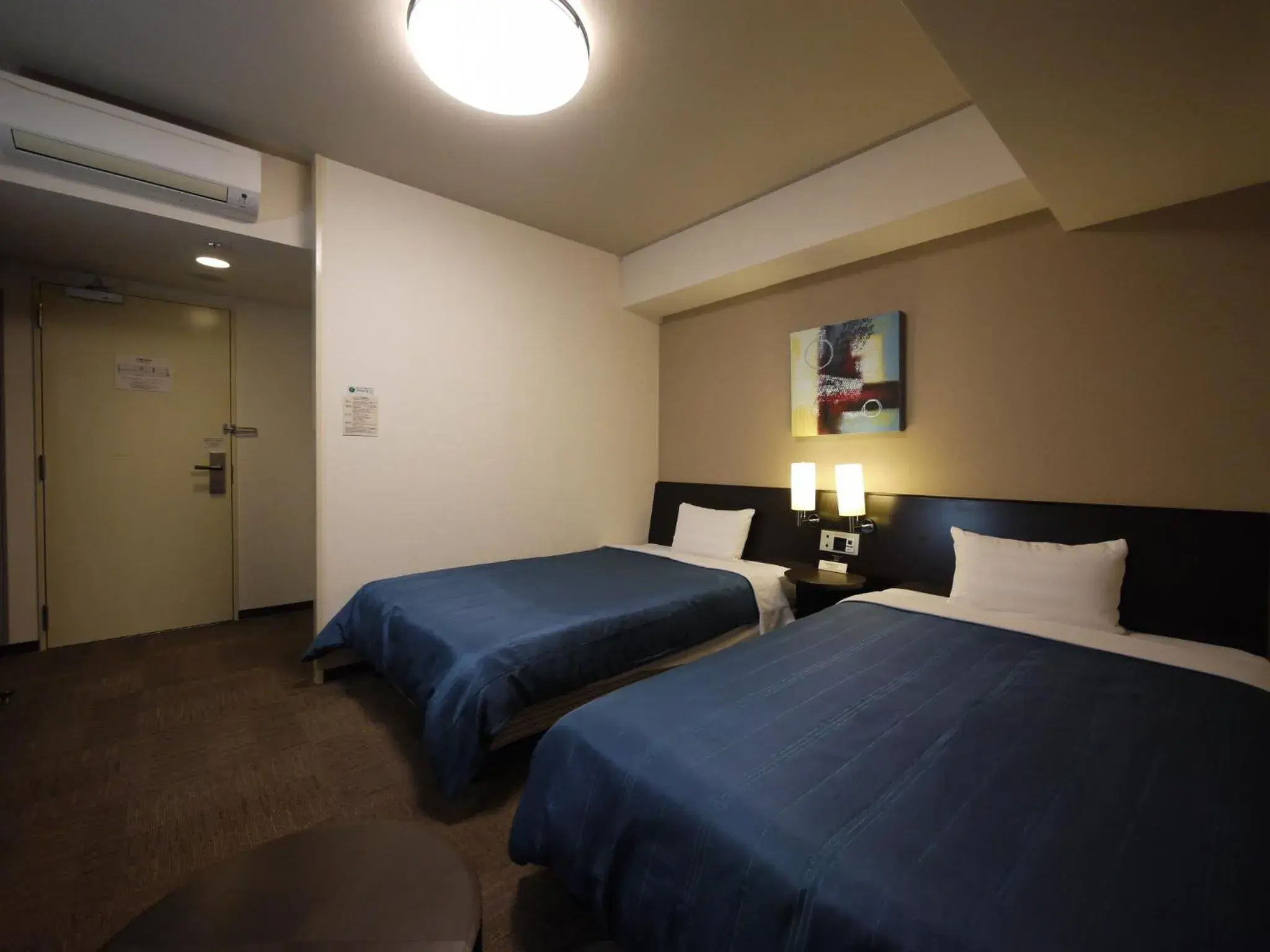 Photo of the whole room, Bed in Hotel Route-Inn Hisai Inter Photo of the whole room, Bed in Hotel Route-Inn Hisai Inter