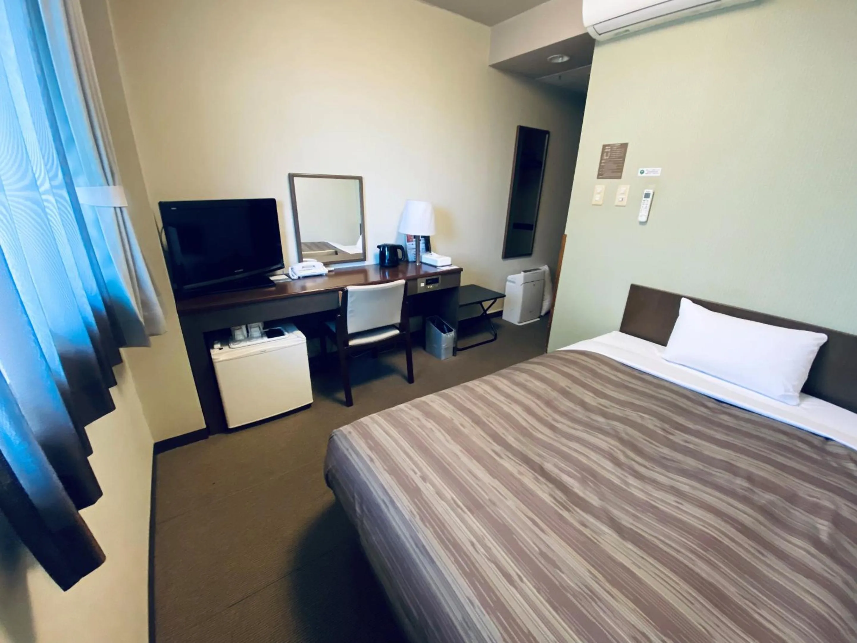 Photo of the whole room, Bed in Hotel Route-Inn Kamisuwa