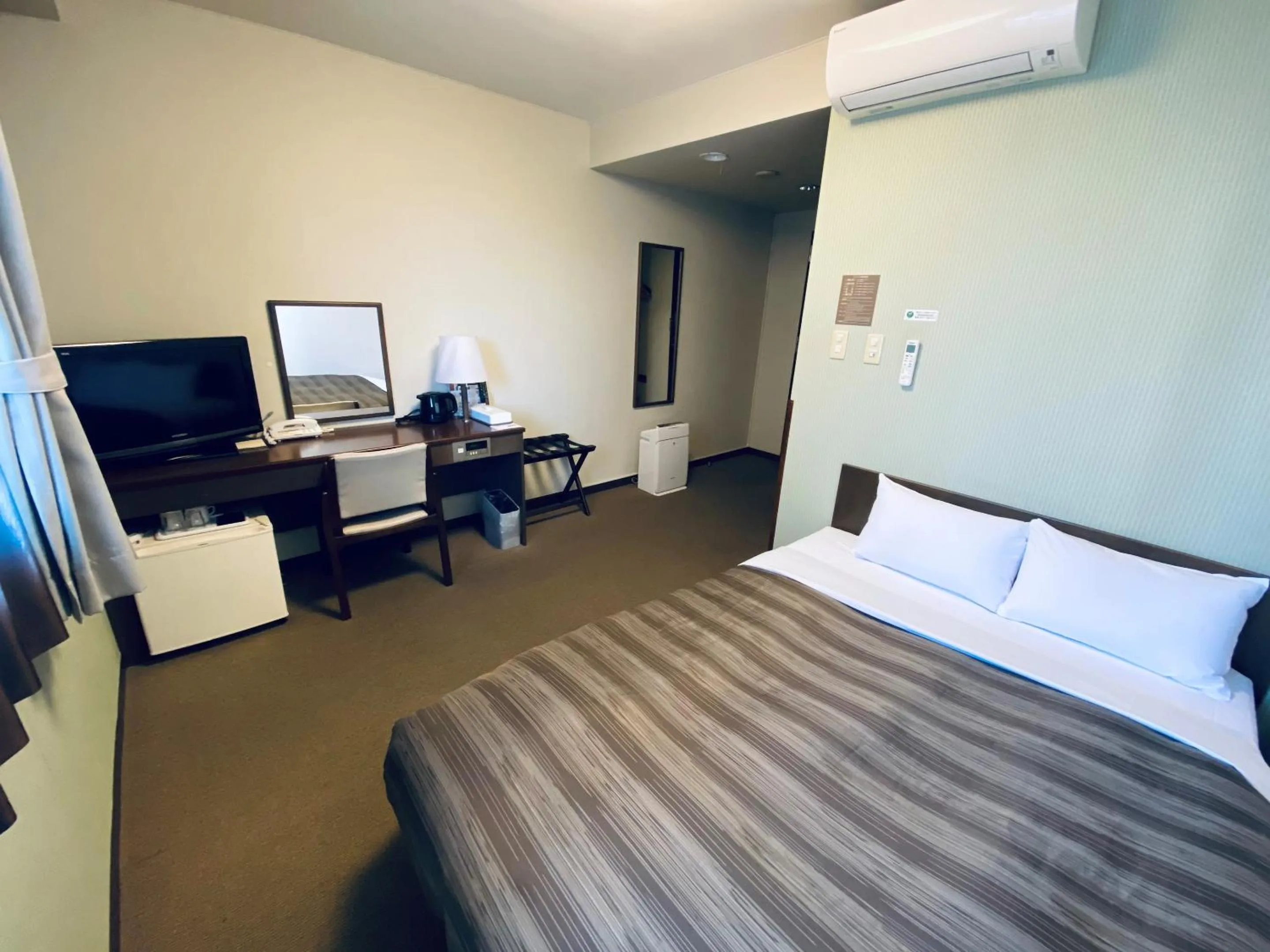 Photo of the whole room, Bed in Hotel Route-Inn Kamisuwa
