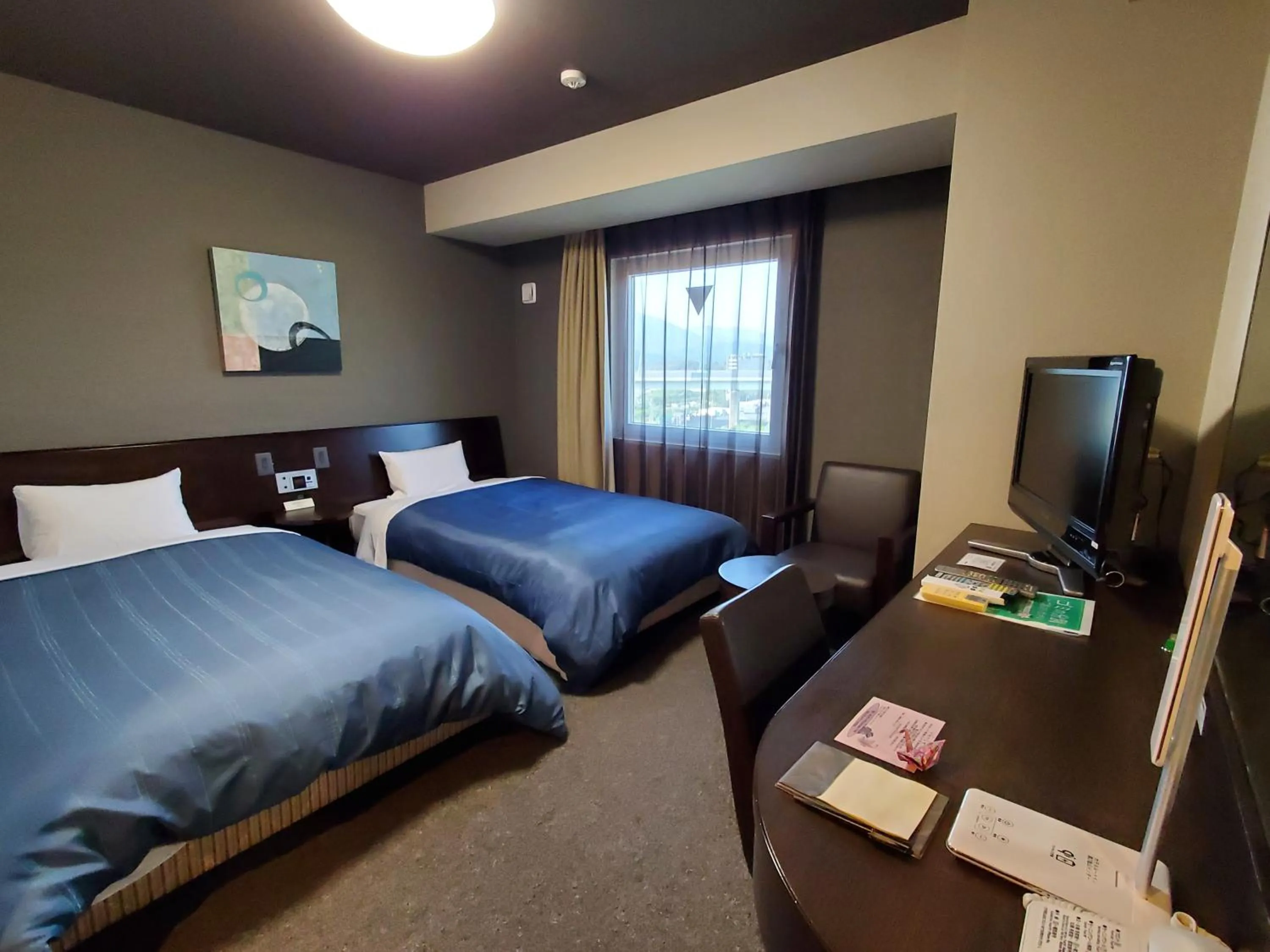 Photo of the whole room, Bed in Hotel Route-Inn Dai-ni Kameyama Inter