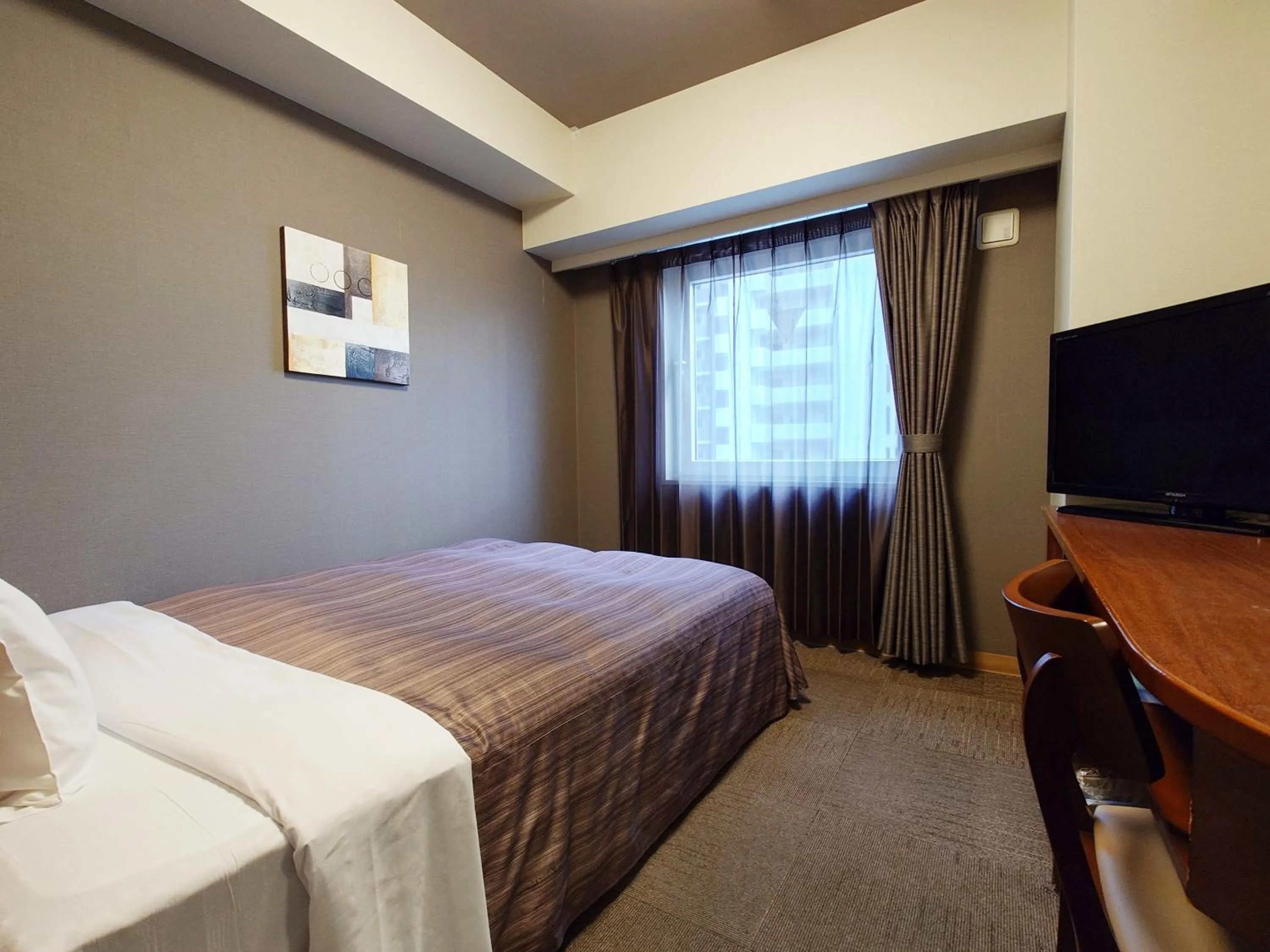 Photo of the whole room, Bed in Hotel Route-Inn Koga Ekimae