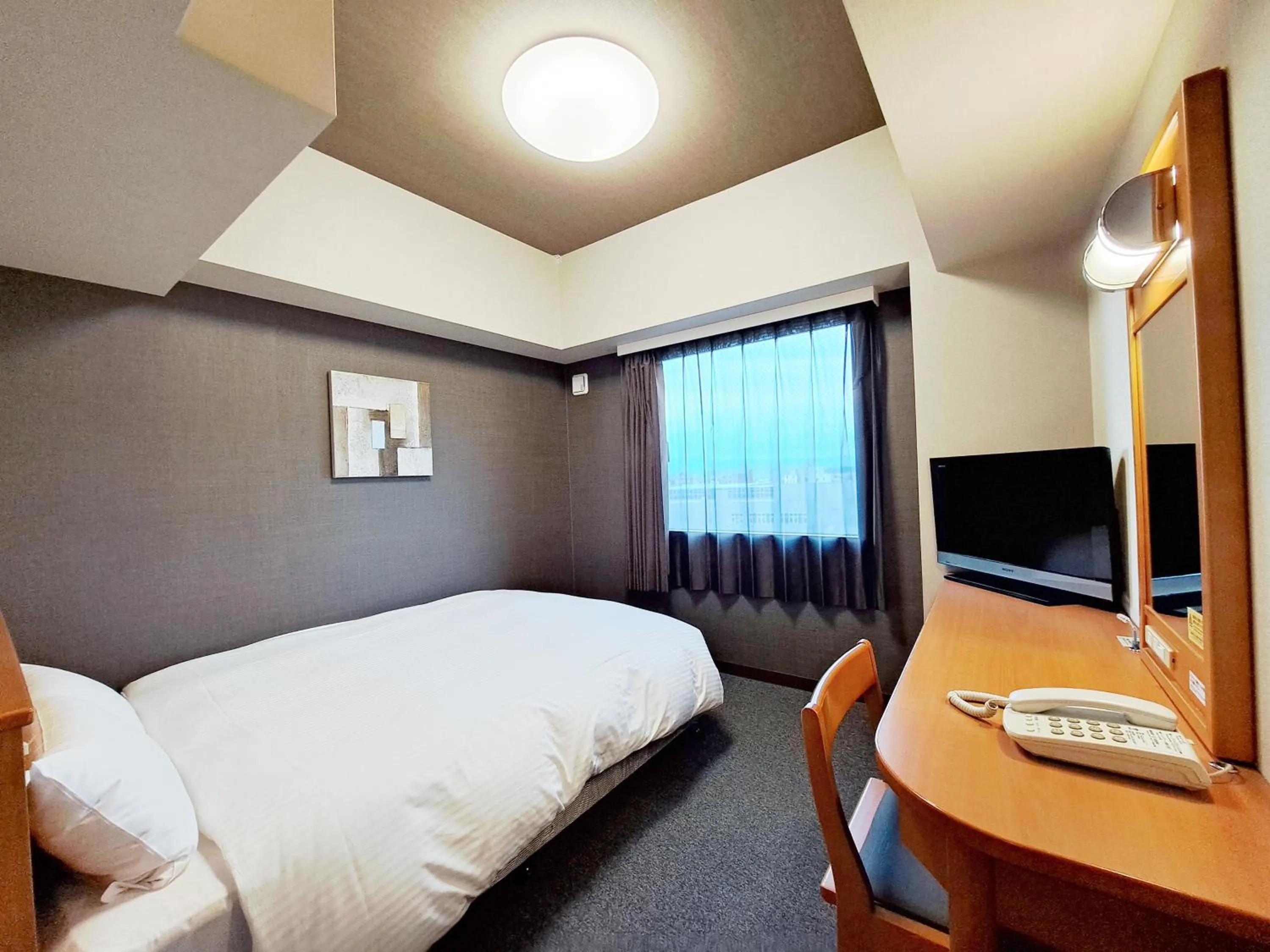 Photo of the whole room, Bed in Hotel Route-Inn Shinjyo Ekimae