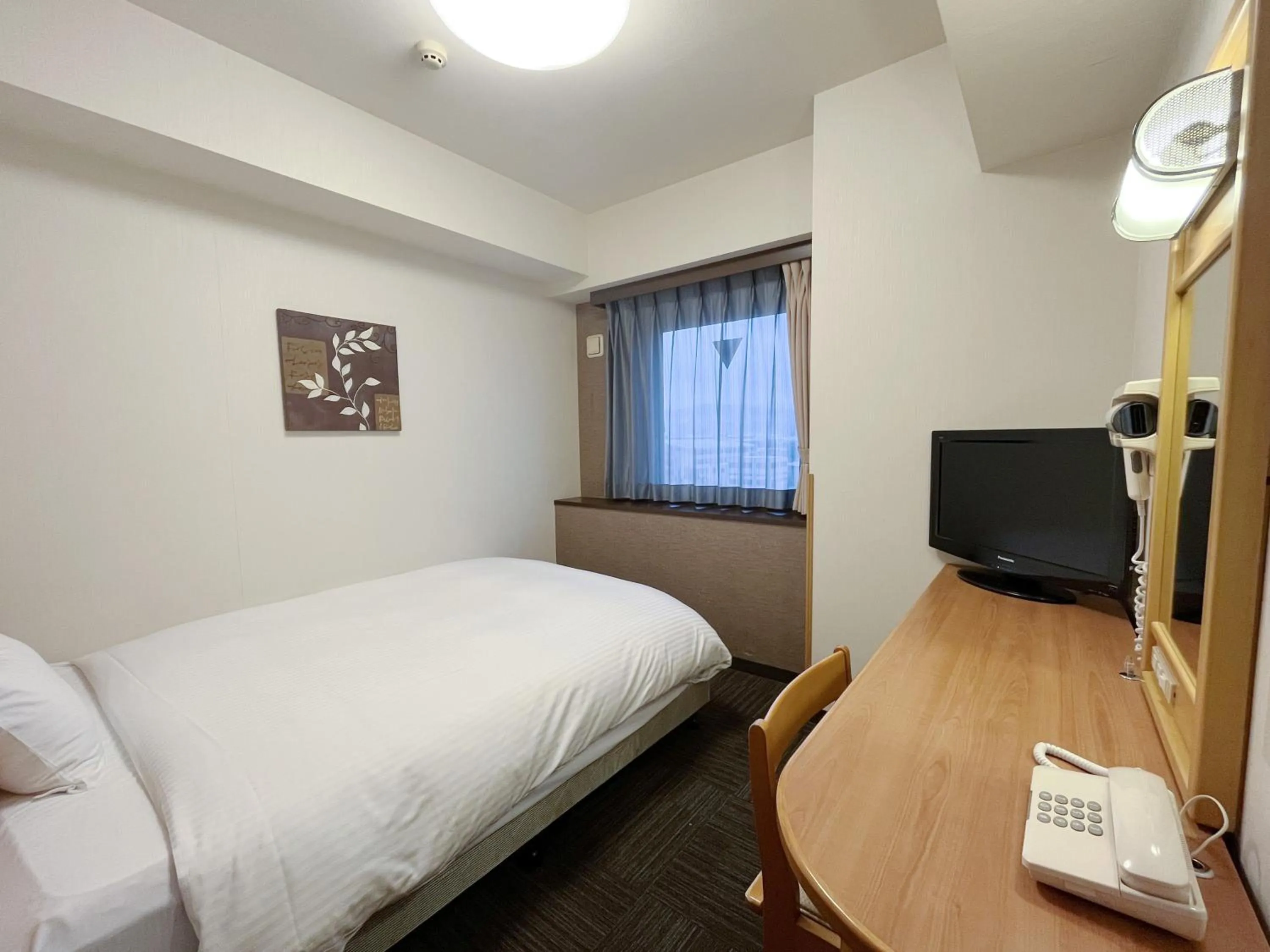 Photo of the whole room, Bed in Hotel Route-Inn Yamagata Ekimae