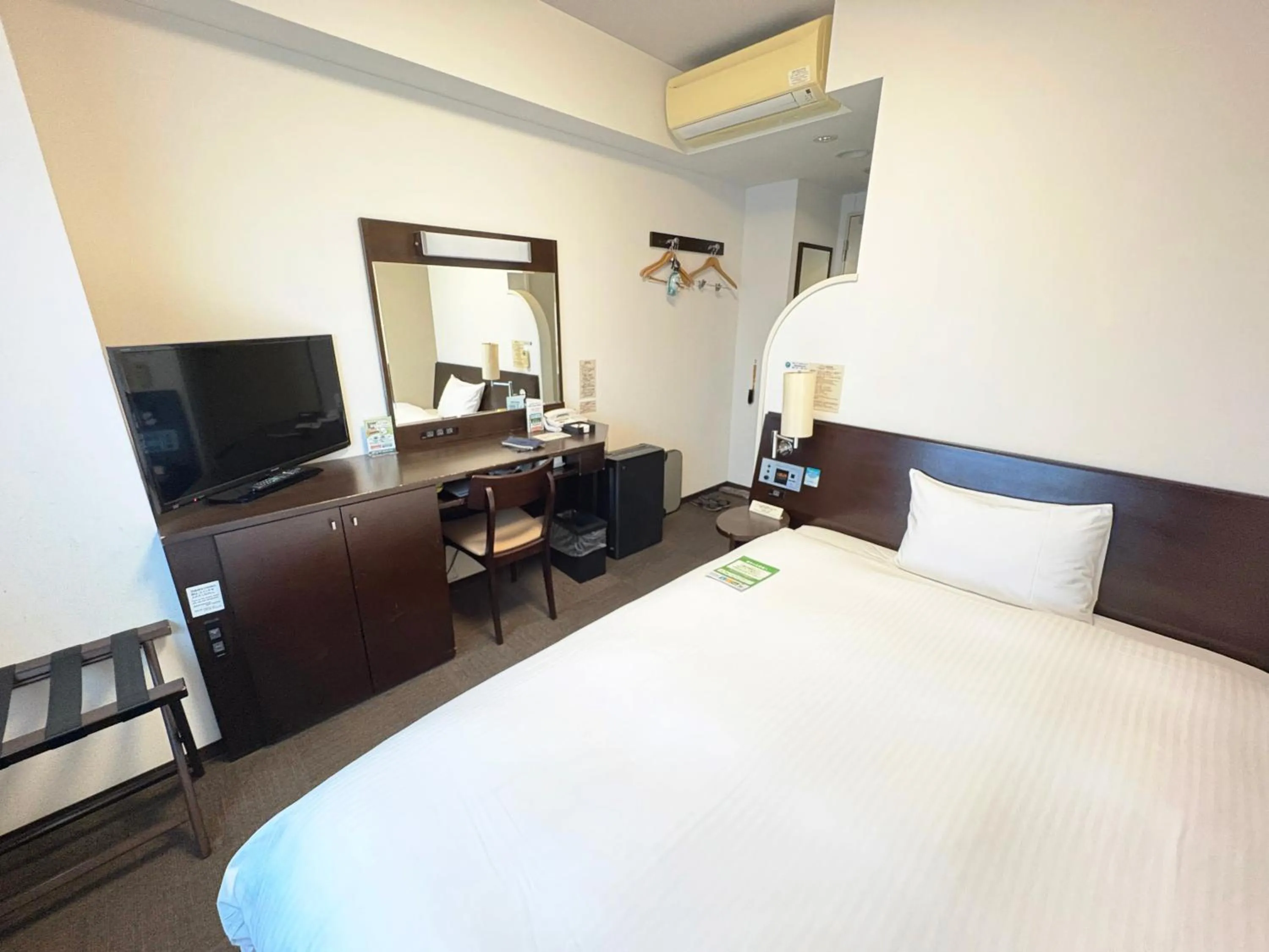 Photo of the whole room, Bed in Hotel Route-Inn Tsuruoka Ekimae