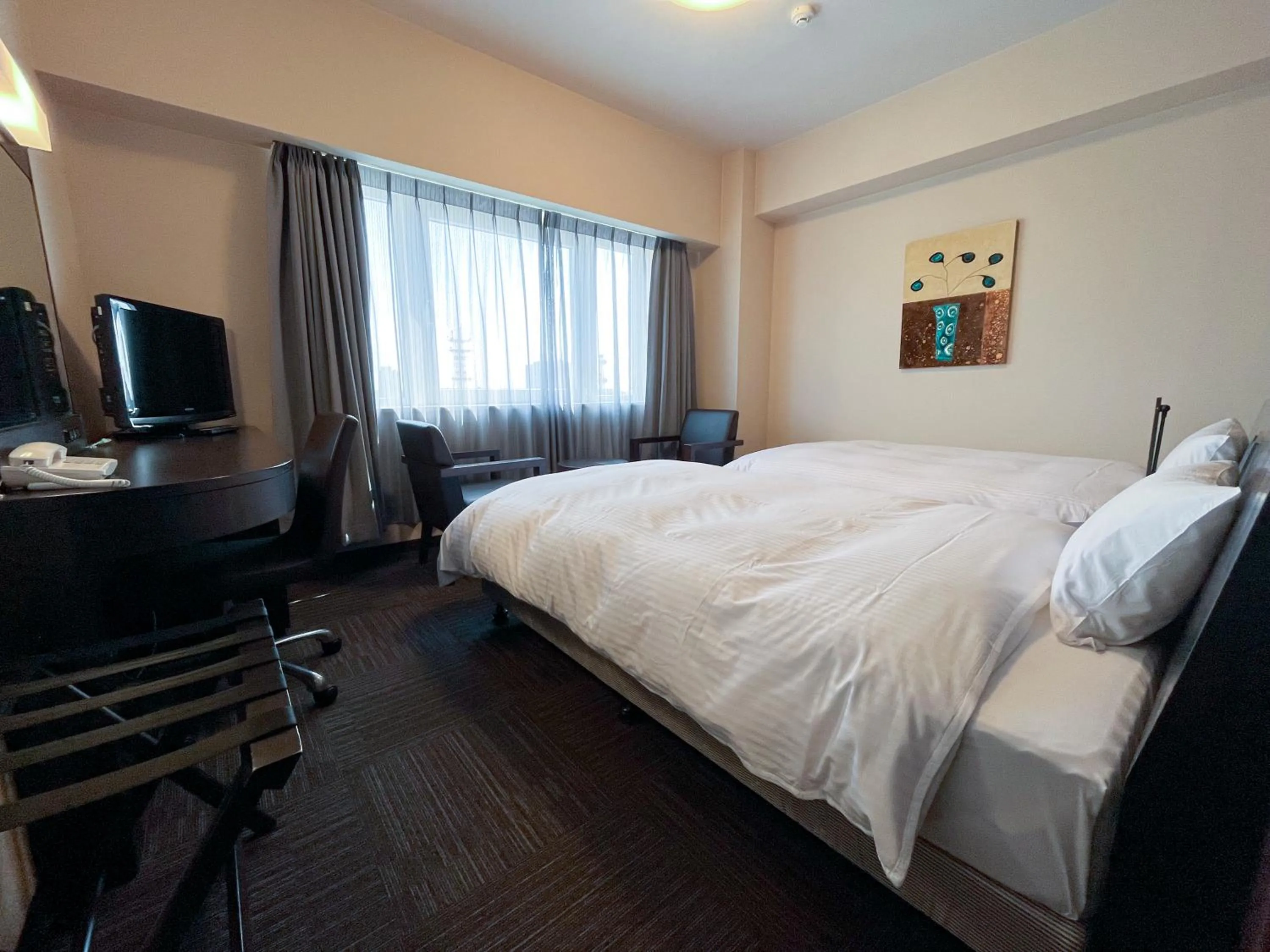 Photo of the whole room, Bed in Hotel Route-Inn Kushiro Ekimae