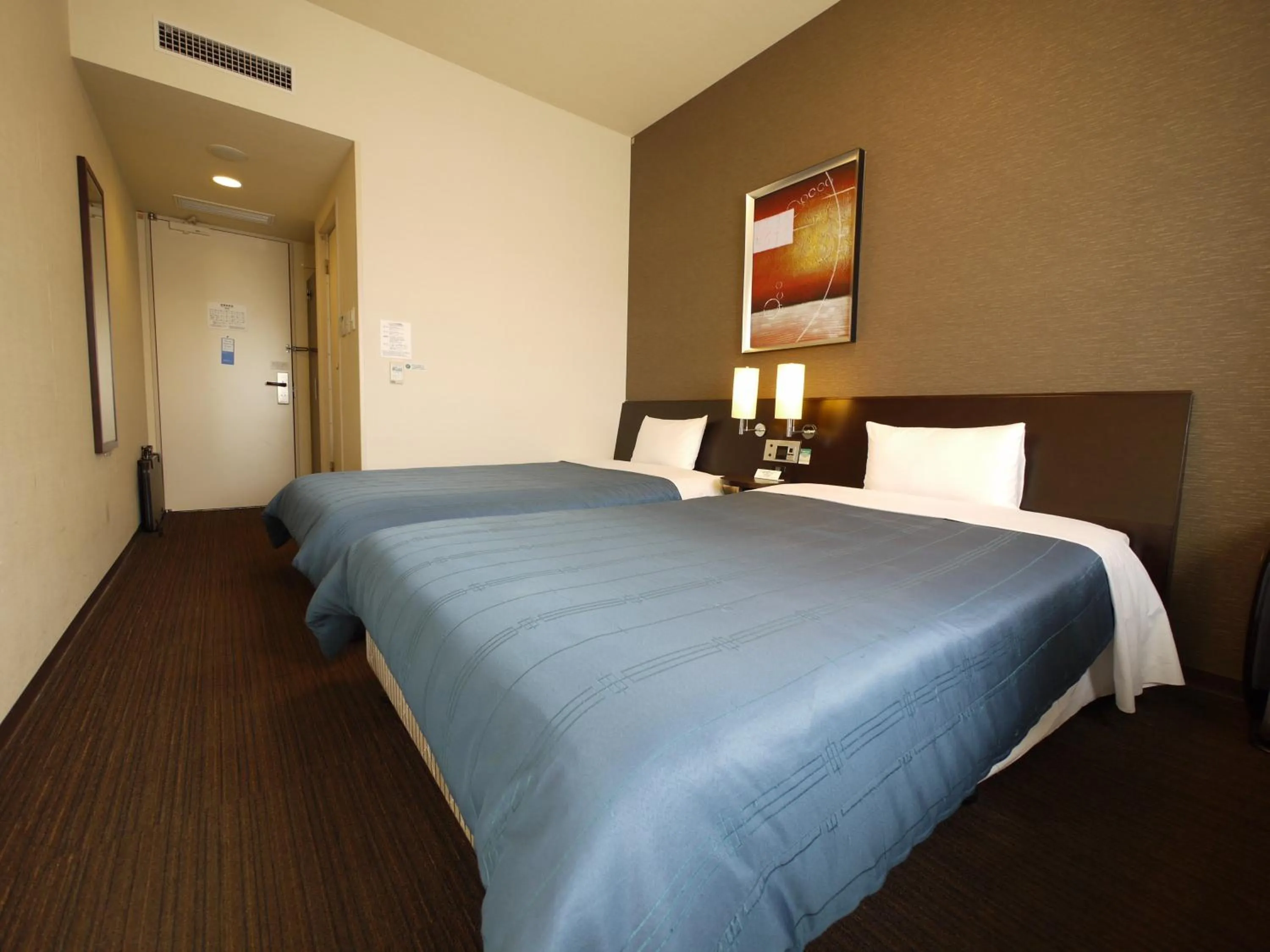 Photo of the whole room, Bed in Hotel Route-Inn Higashimuroran Ekimae