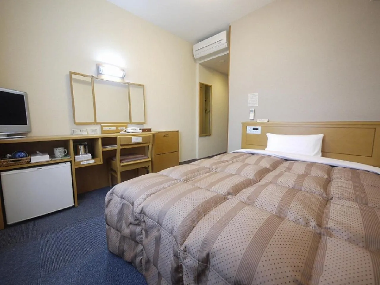 Bed in Hotel Route-Inn Wakamiya Inter