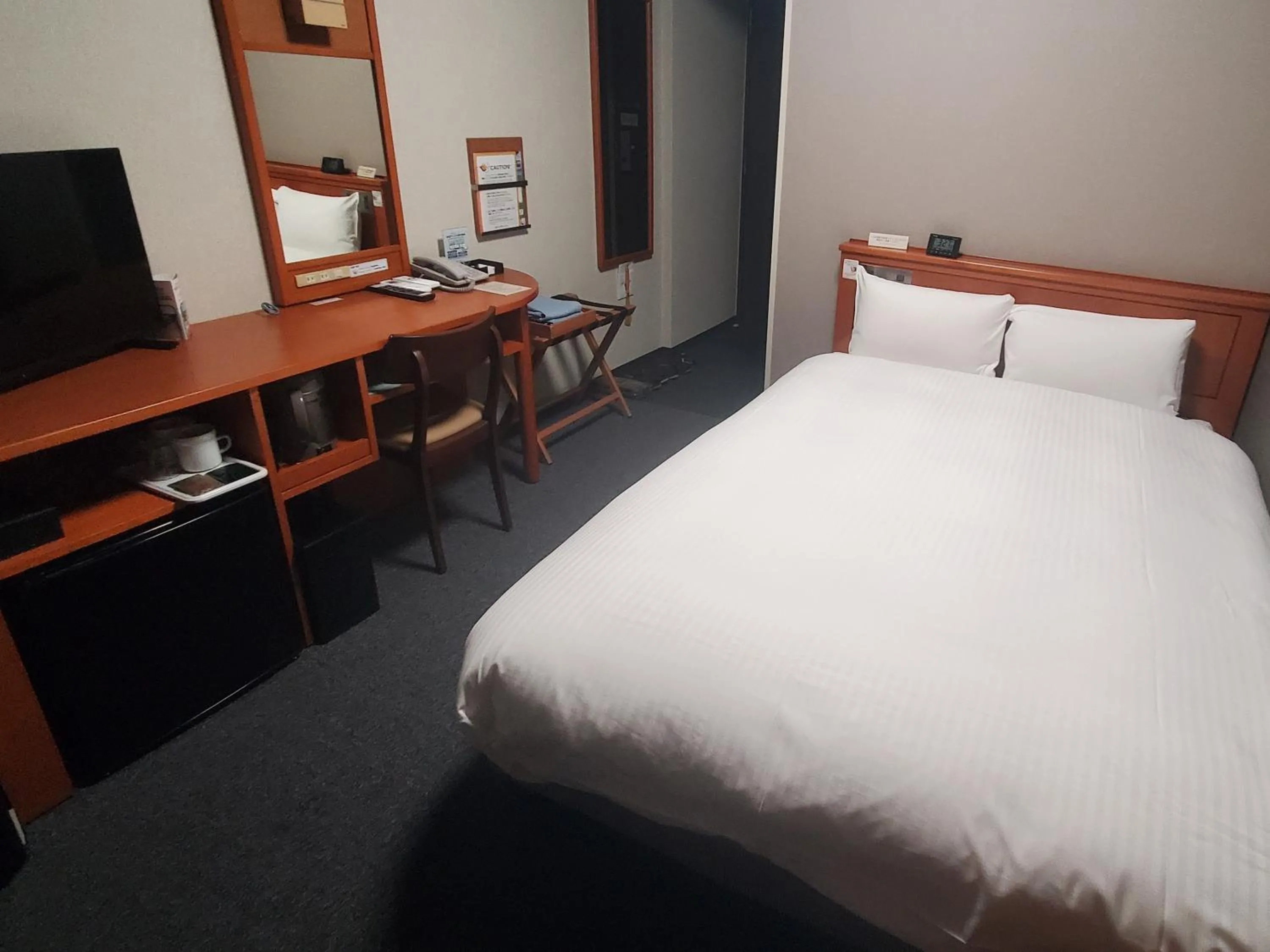 Photo of the whole room, Bed in Hotel Route-Inn Saga Ekimae