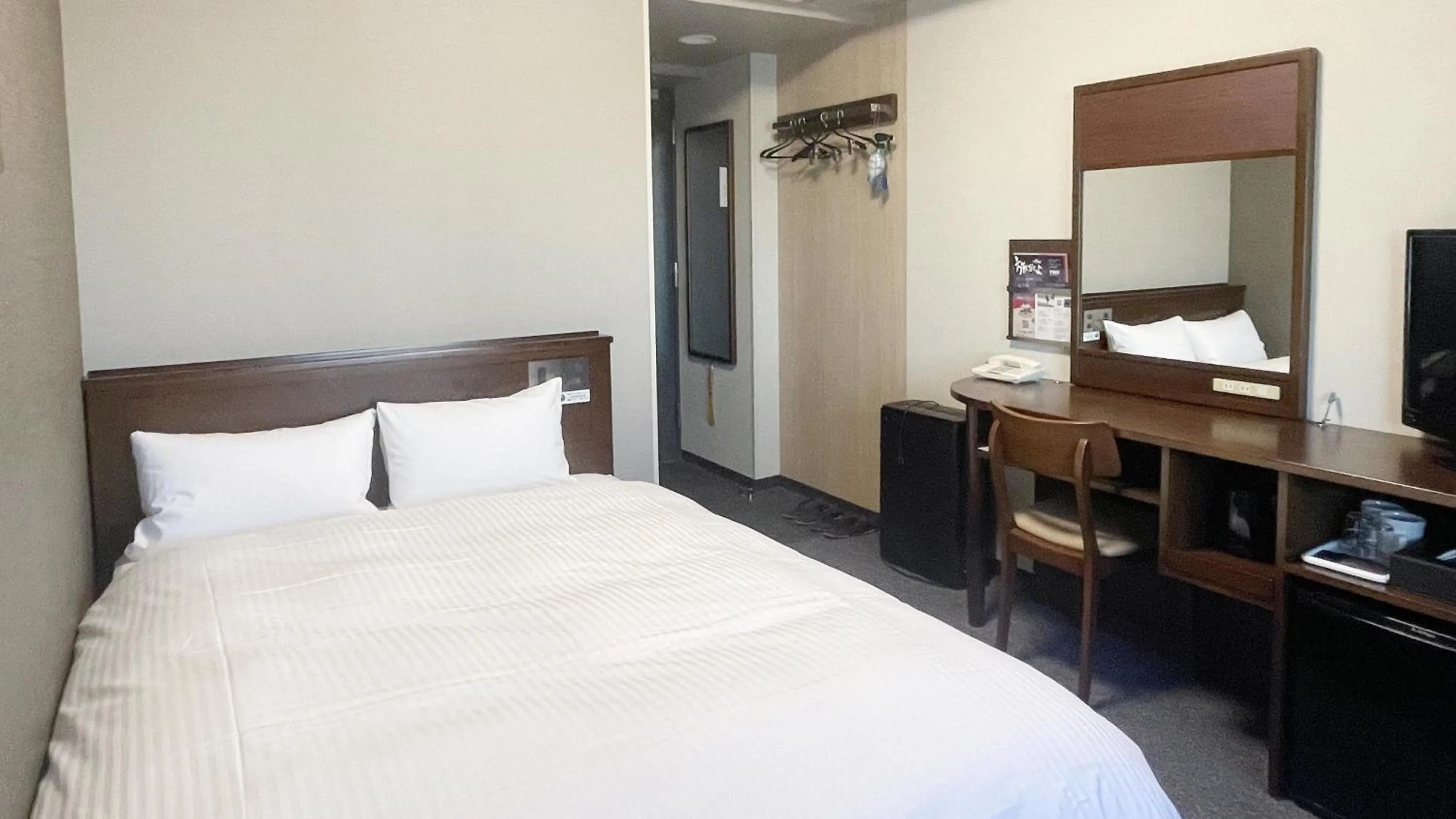 Photo of the whole room, Bed in Hotel Route-Inn Mitsukaido Ekimae