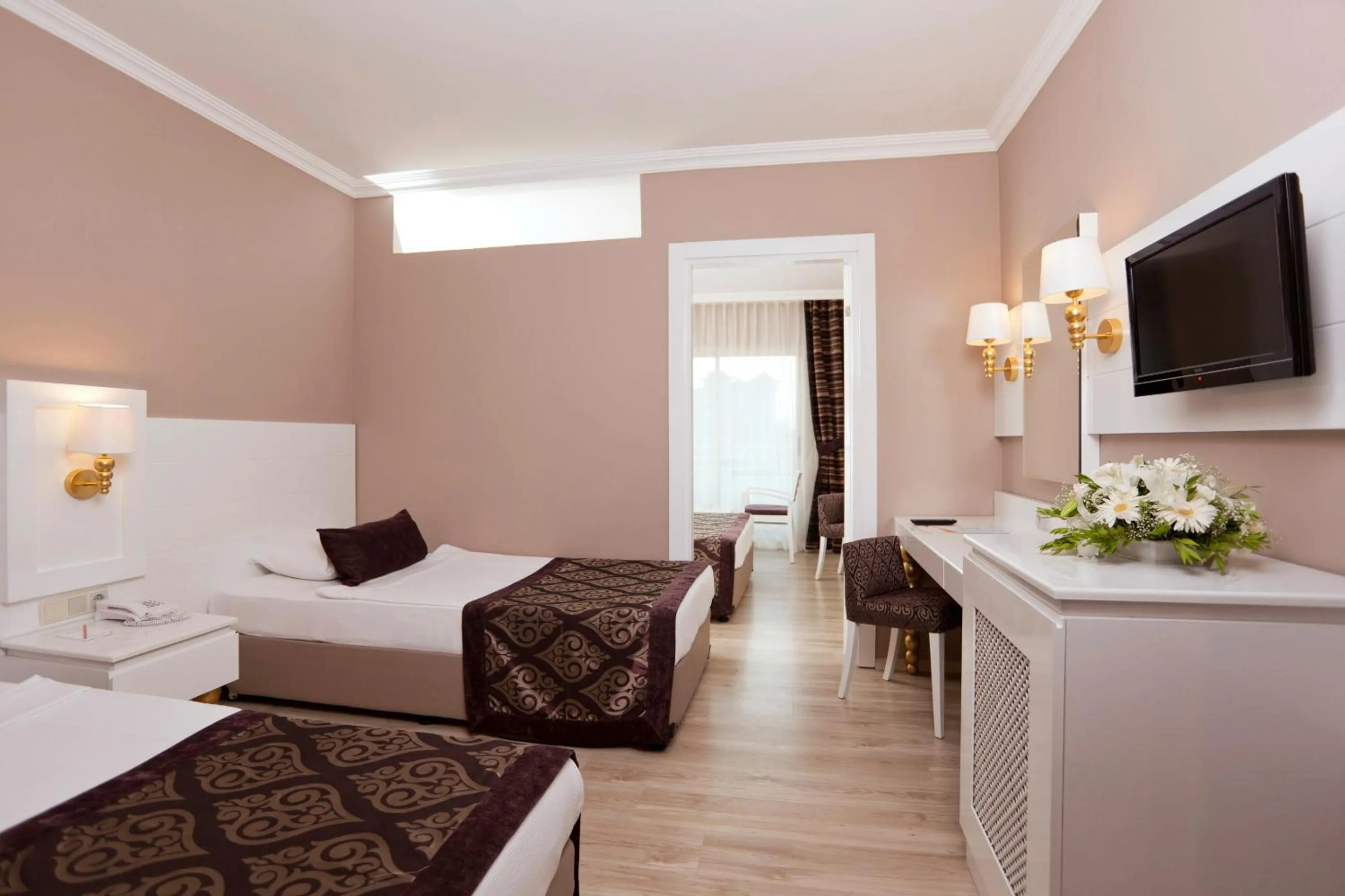 Communal lounge/ TV room, Bed in Serenis Hotel