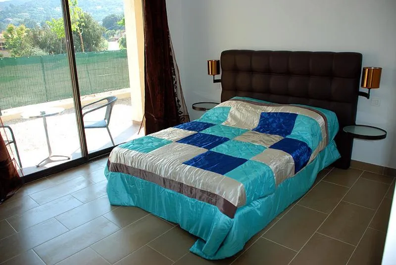 Bed in Hôtel l'Alivu