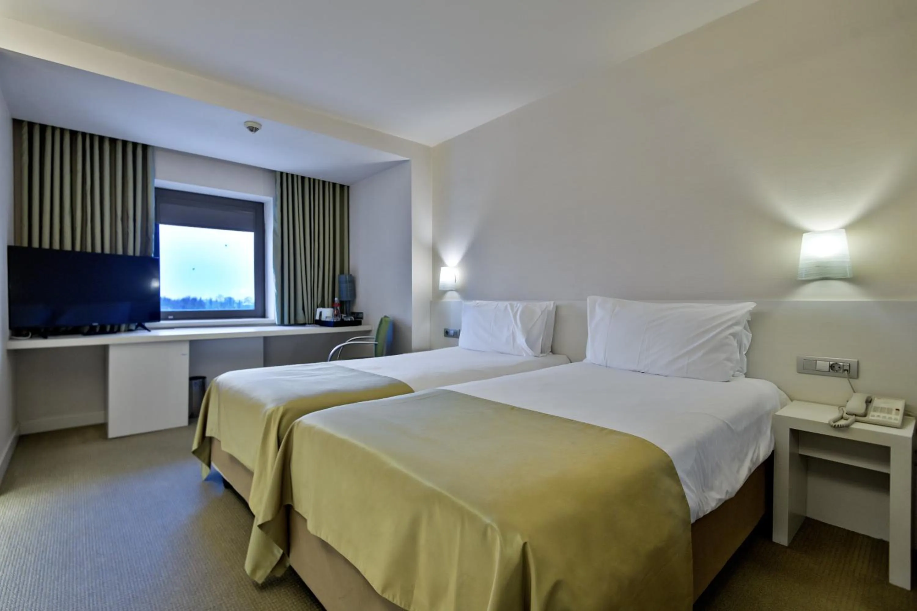 Bed in Ramada Plaza by Wyndham Bucharest Convention Center