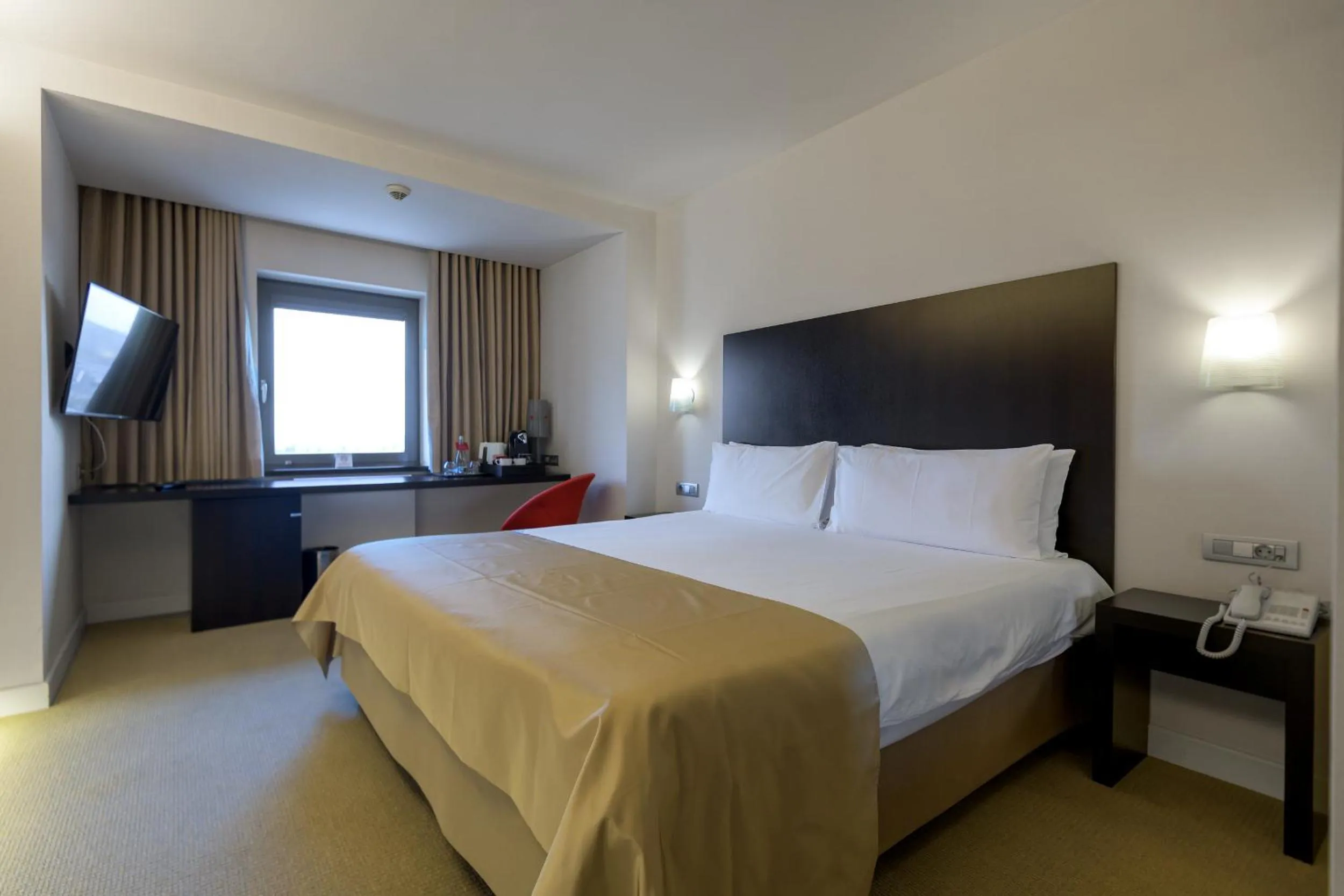 Bed in Ramada Plaza by Wyndham Bucharest Convention Center