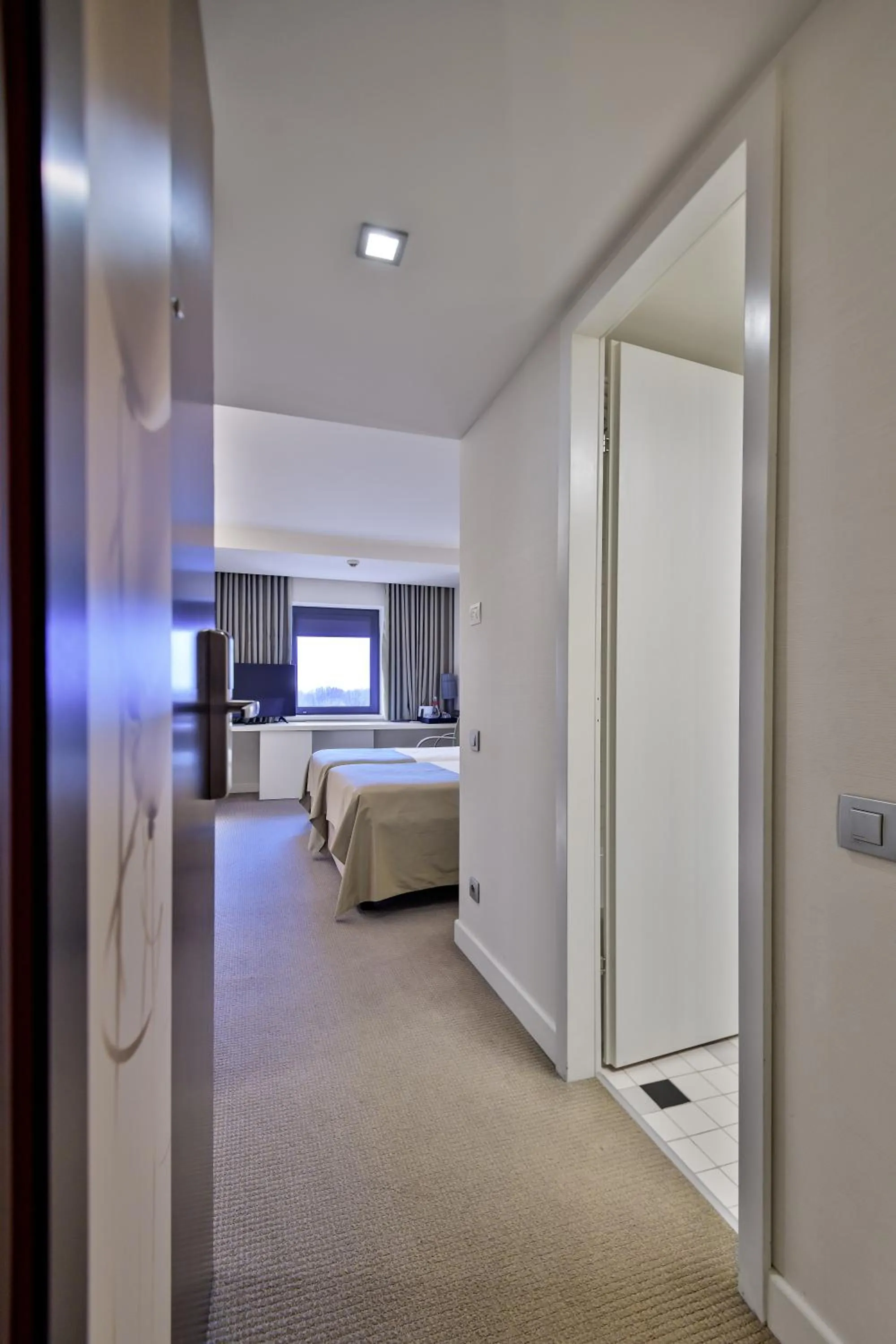 Photo of the whole room, Bed in Ramada Plaza by Wyndham Bucharest Convention Center