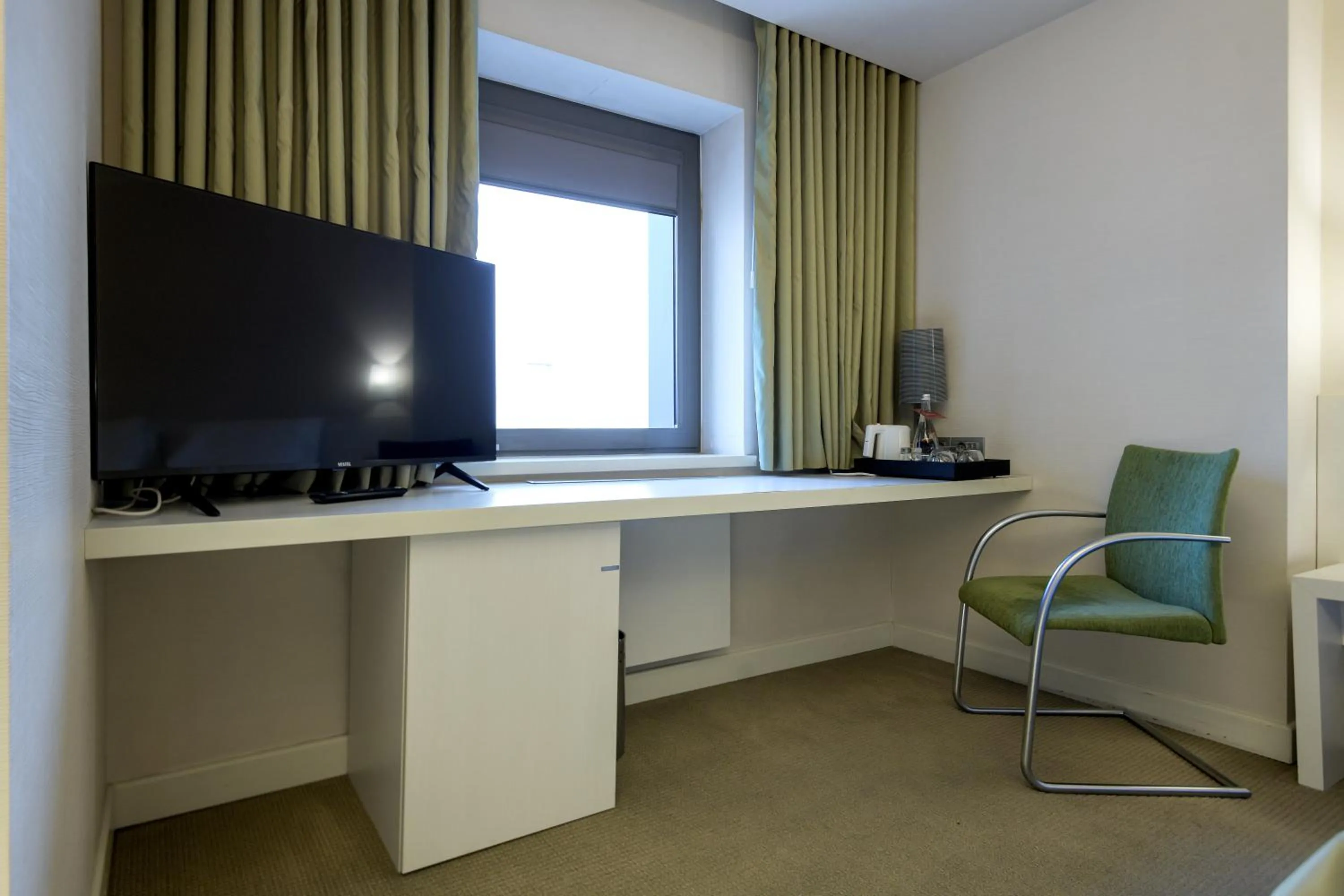 Bedroom in Ramada Plaza by Wyndham Bucharest Convention Center