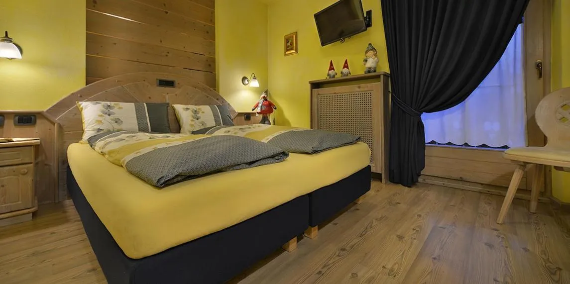 Bed in Hotel Piccolo Mondo