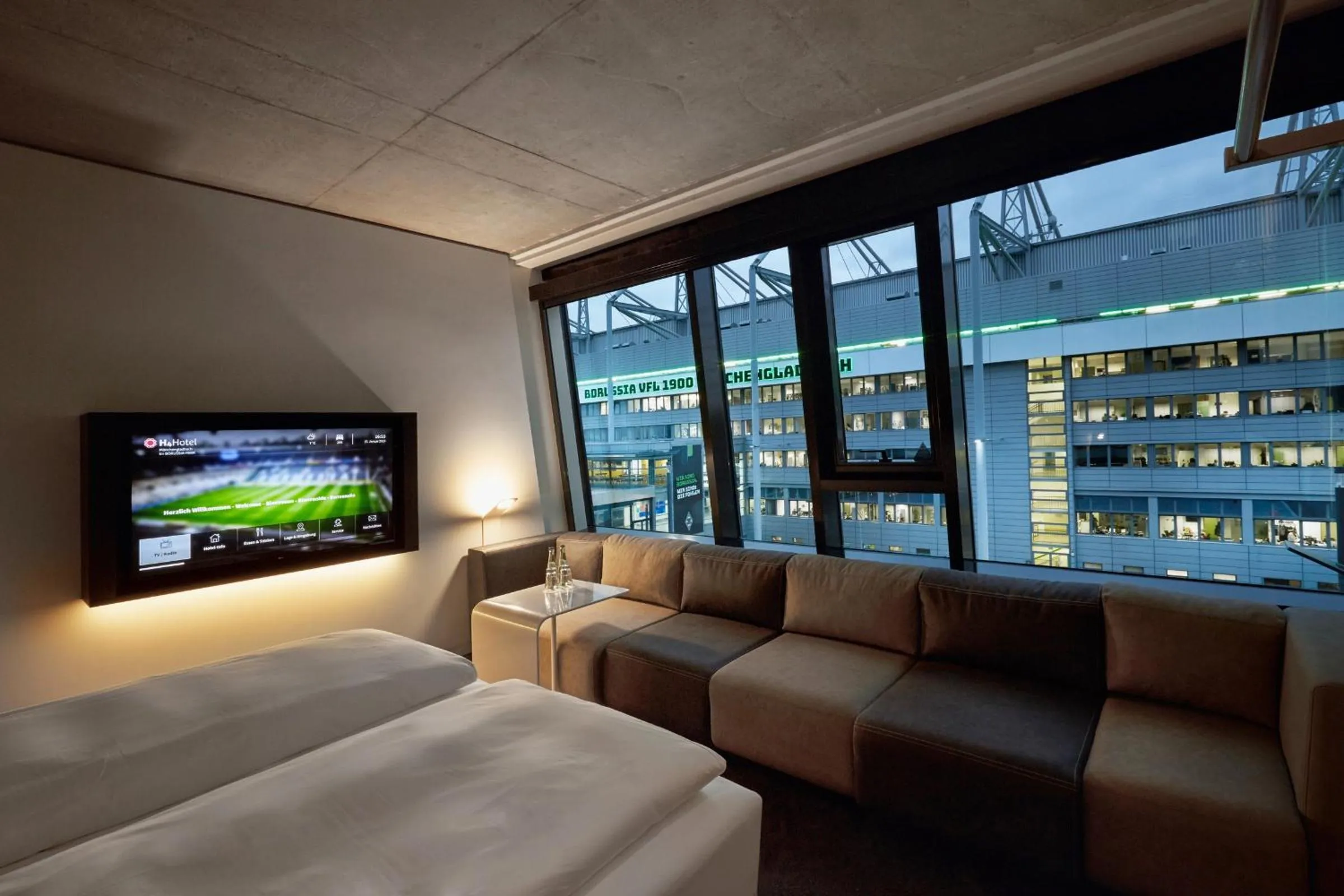Photo of the whole room, Bed in H4 Hotel Mönchengladbach im BORUSSIA-PARK