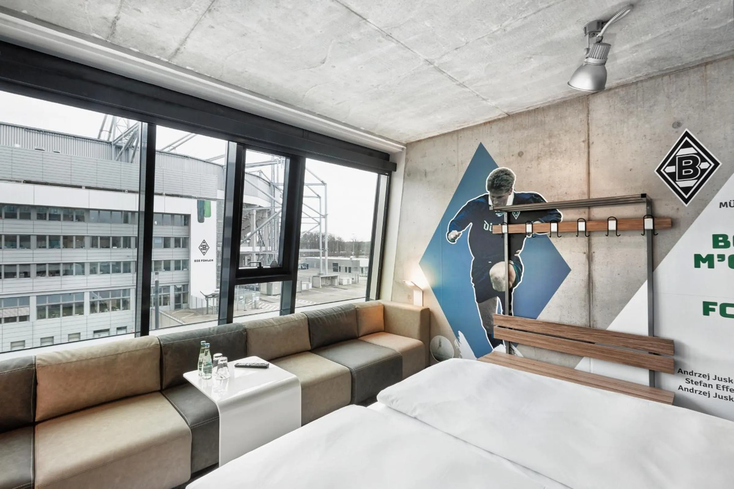 Photo of the whole room, Bed in H4 Hotel Mönchengladbach im BORUSSIA-PARK