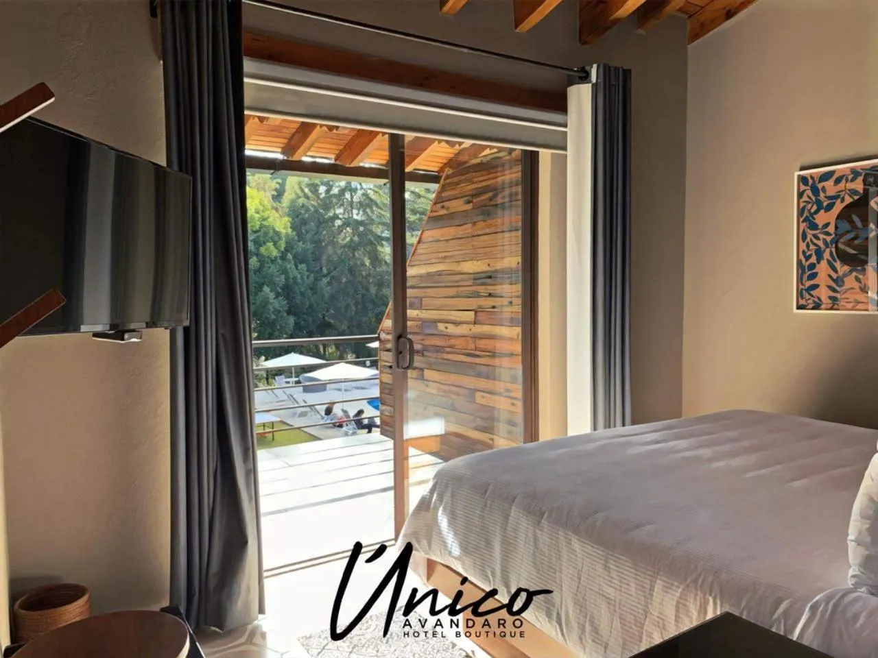 Communal lounge/ TV room, Bed in Hotel Boutique Unico Avandaro