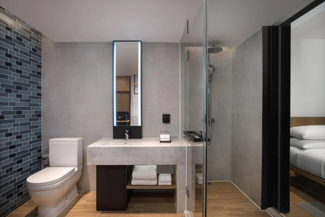 Toilet, Bed in Fairfield by Marriott Guangzhou Tianhe Park